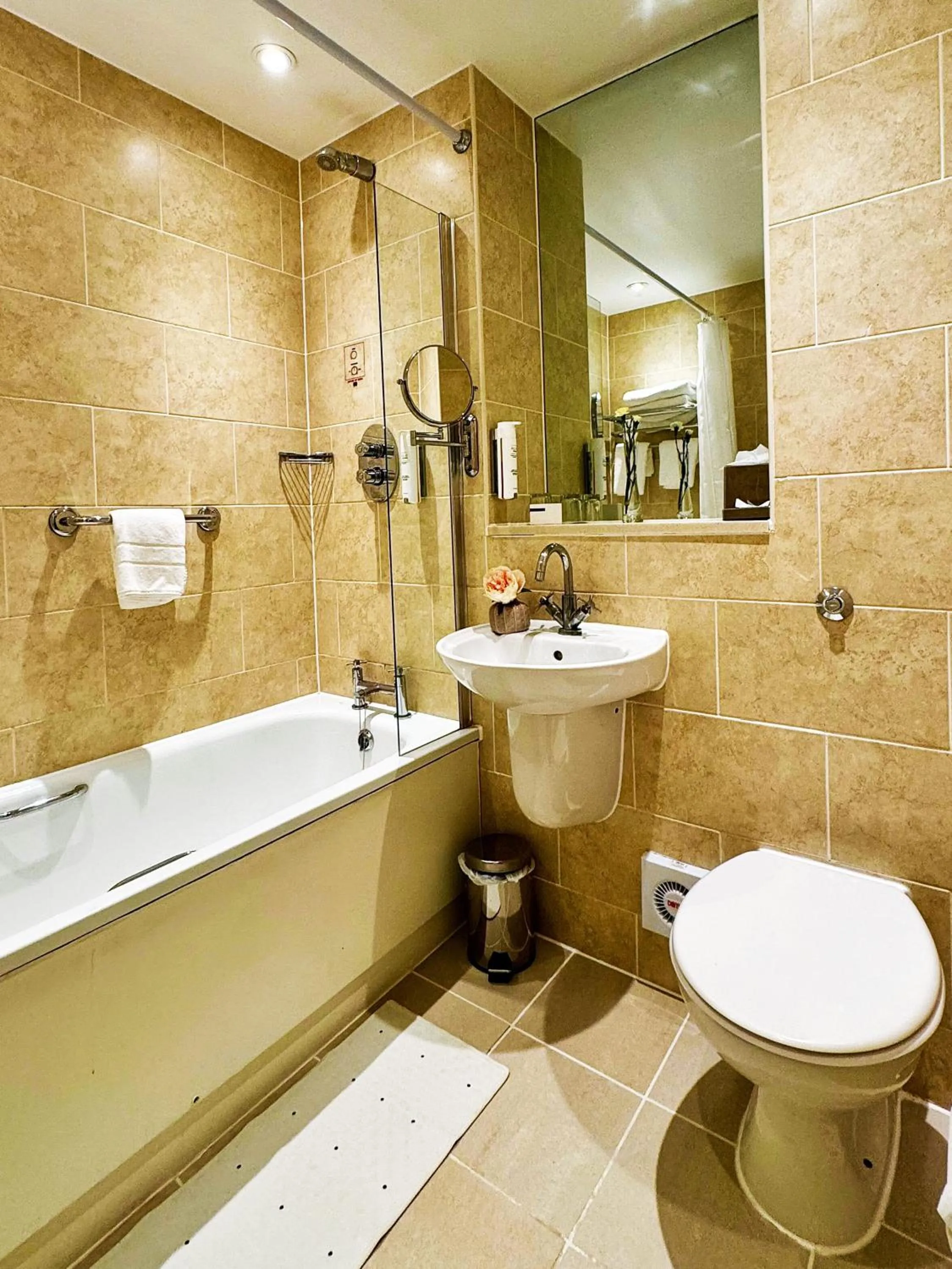 Bathroom in Grovefield House Hotel By Uno
