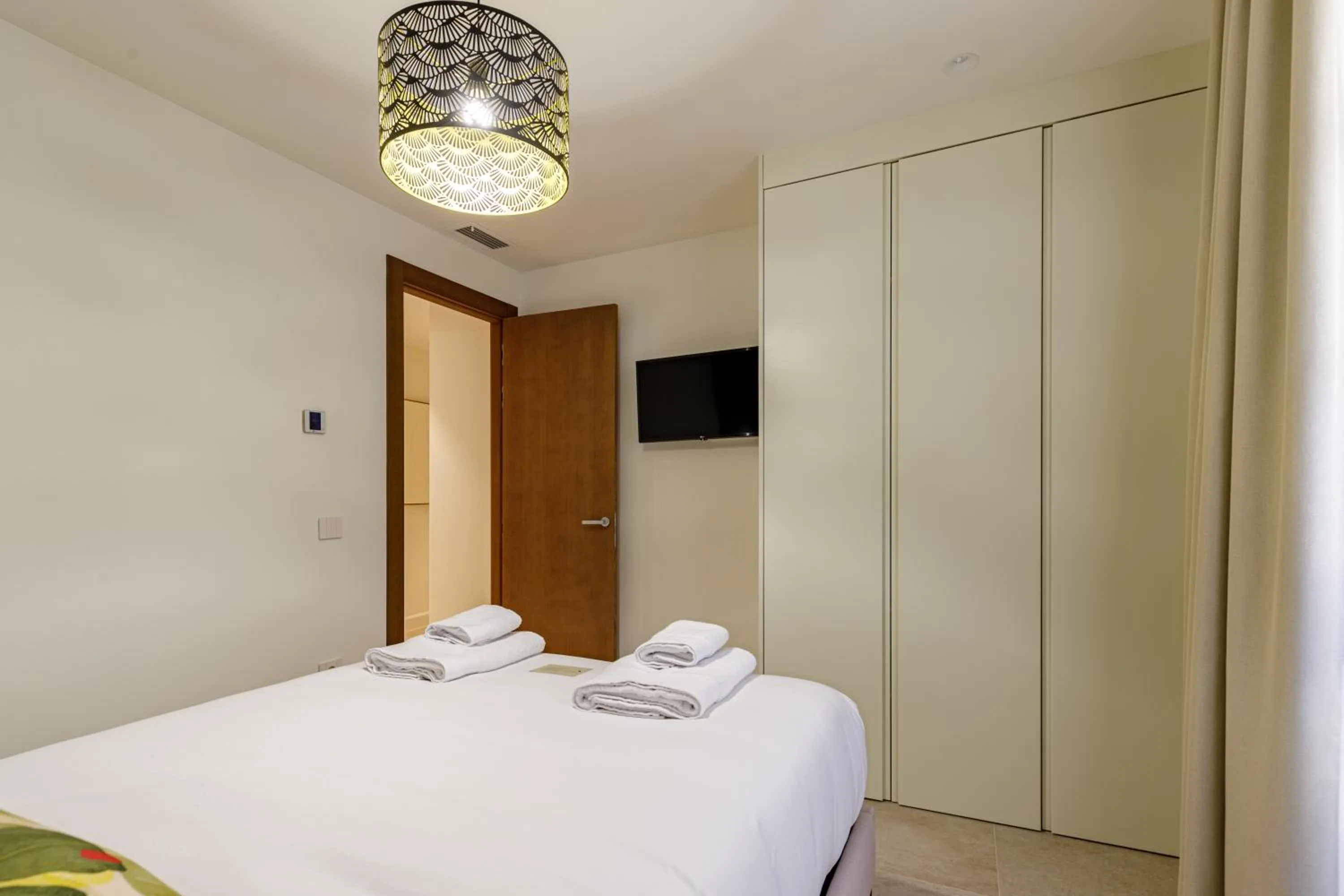 Bed in Plaza del Siglo Suites & Boutique Apartments by Caleta Homes