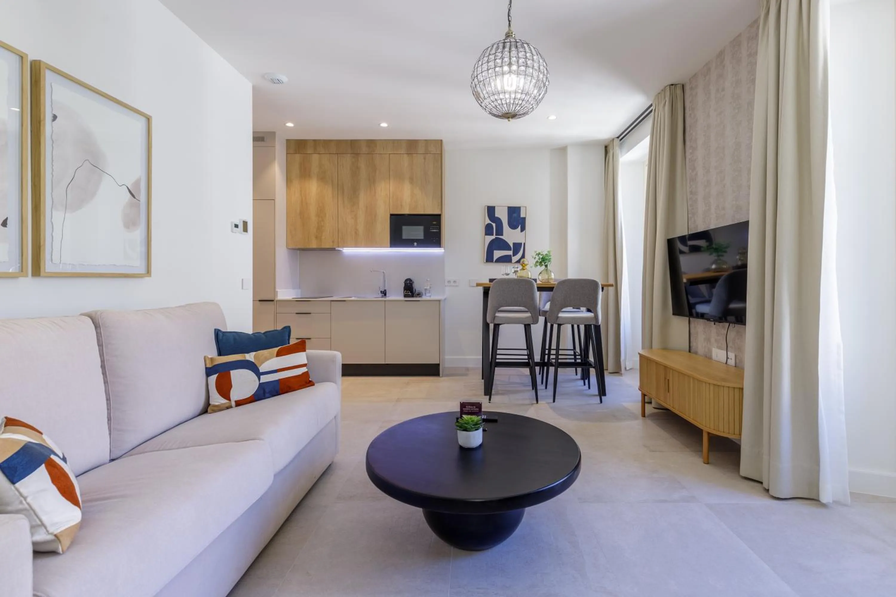 Communal lounge/ TV room in Plaza del Siglo Suites & Boutique Apartments by Caleta Homes
