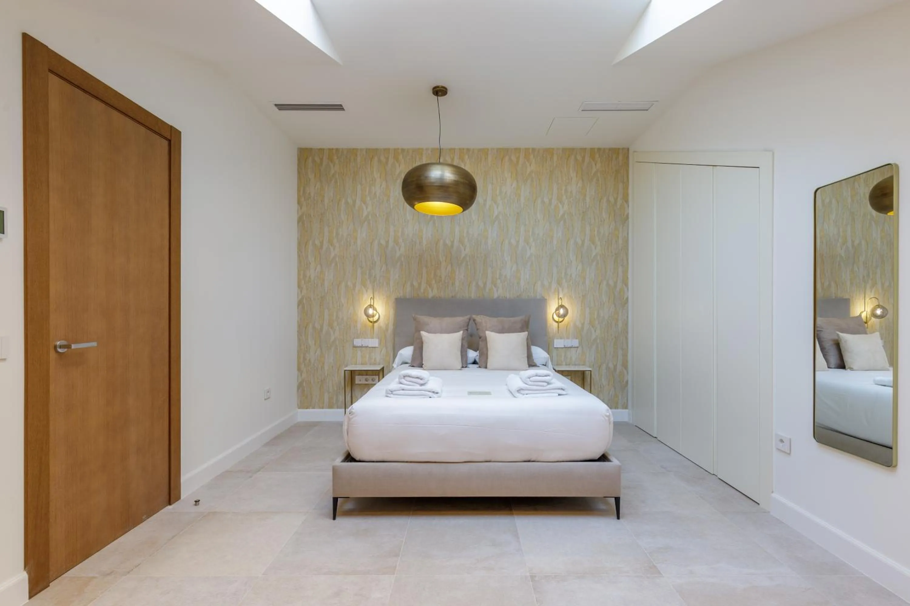 Bed in Plaza del Siglo Suites & Boutique Apartments by Caleta Homes