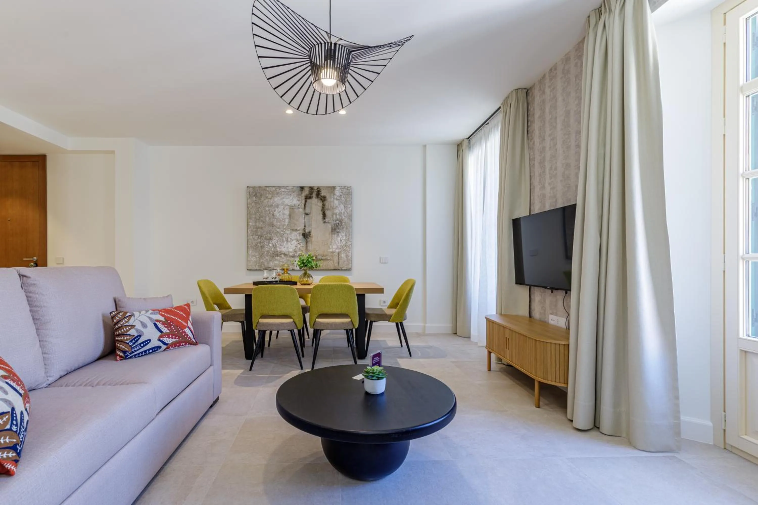 Communal lounge/ TV room in Plaza del Siglo Suites & Boutique Apartments by Caleta Homes