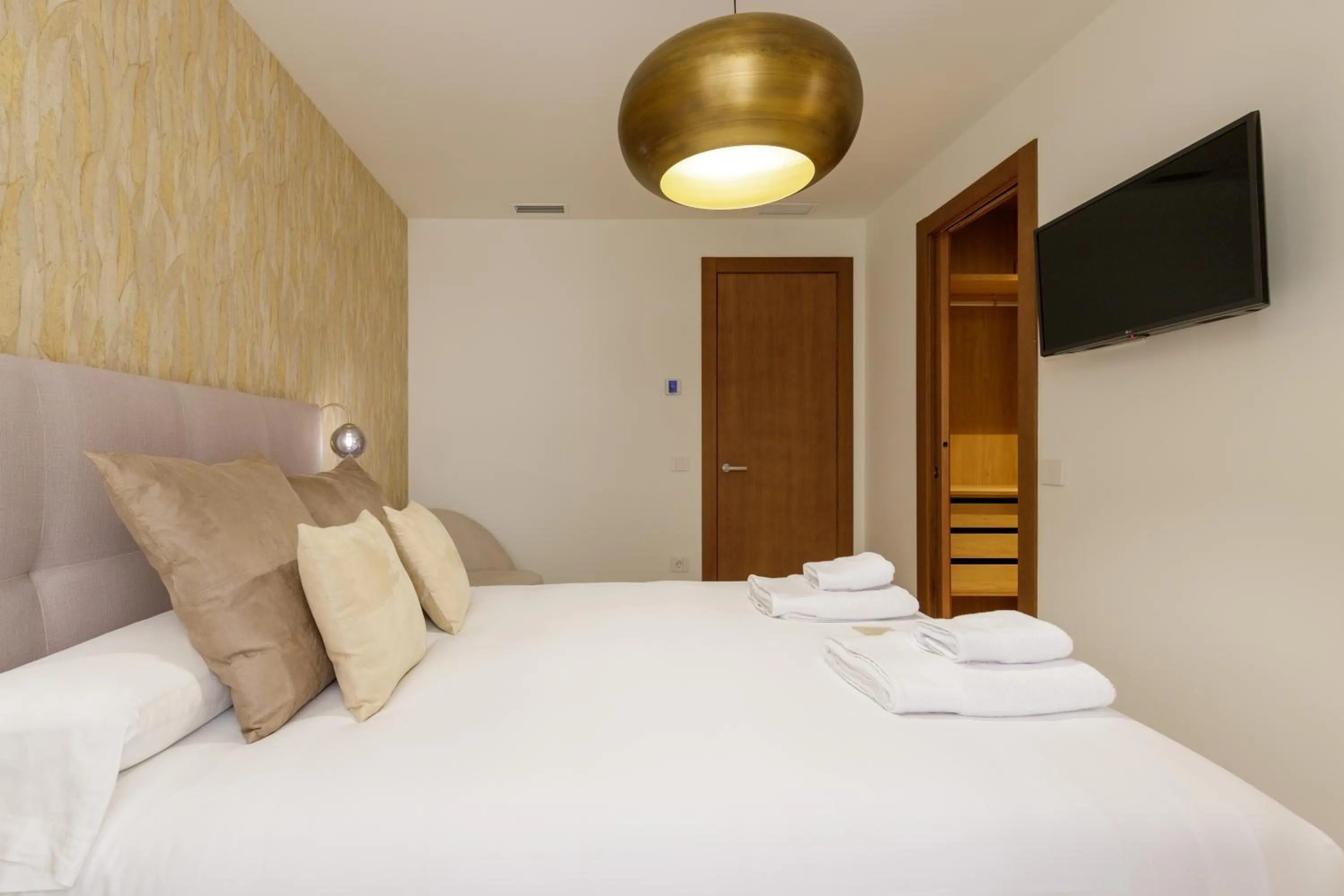 Bed in Plaza del Siglo Suites & Boutique Apartments by Caleta Homes