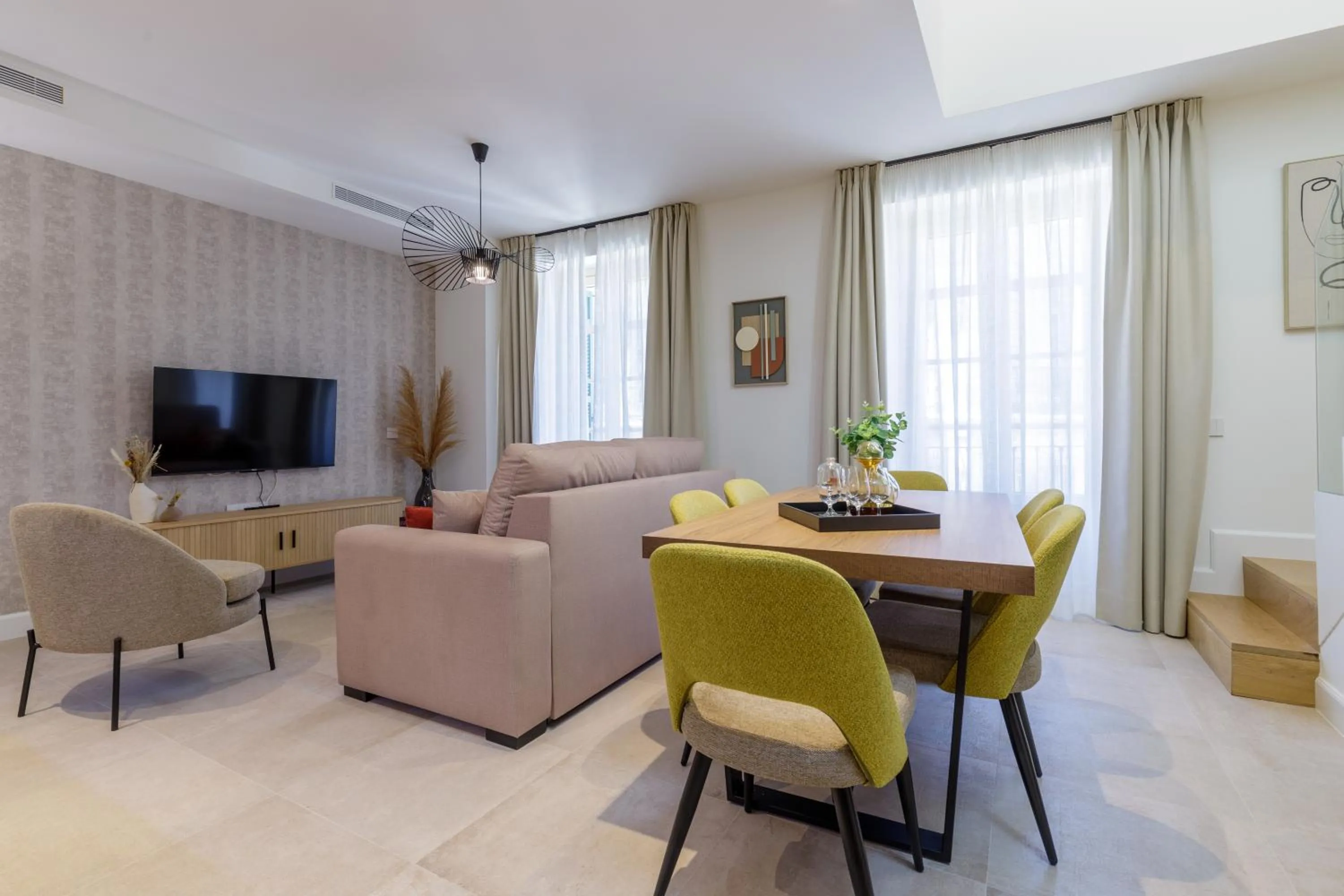 Communal lounge/ TV room in Plaza del Siglo Suites & Boutique Apartments by Caleta Homes