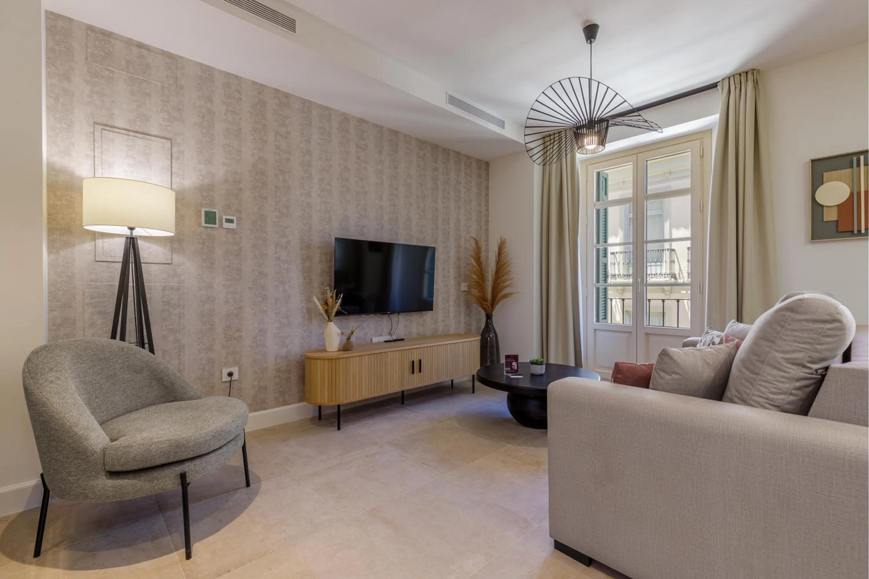Communal lounge/ TV room in Plaza del Siglo Suites & Boutique Apartments by Caleta Homes