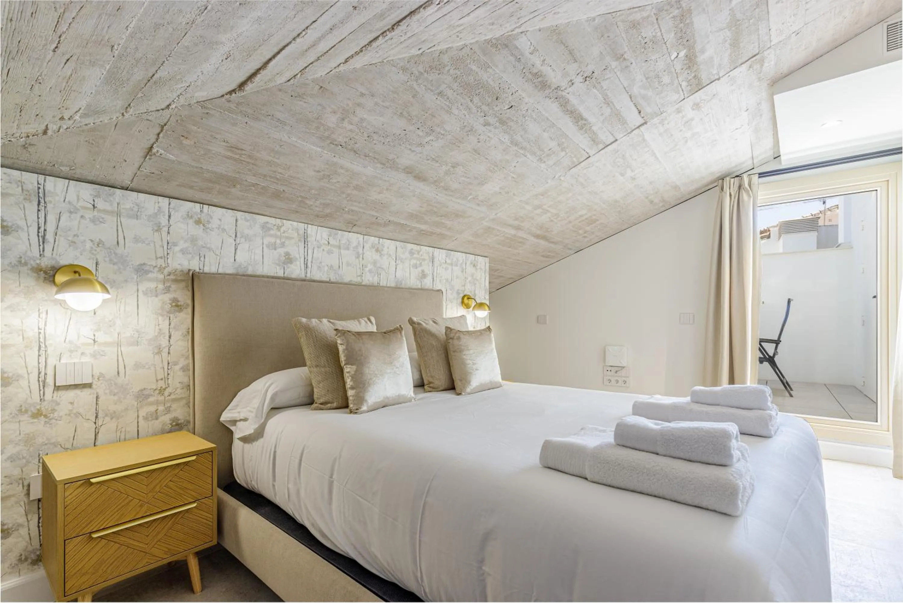 Bed in Plaza del Siglo Suites & Boutique Apartments by Caleta Homes
