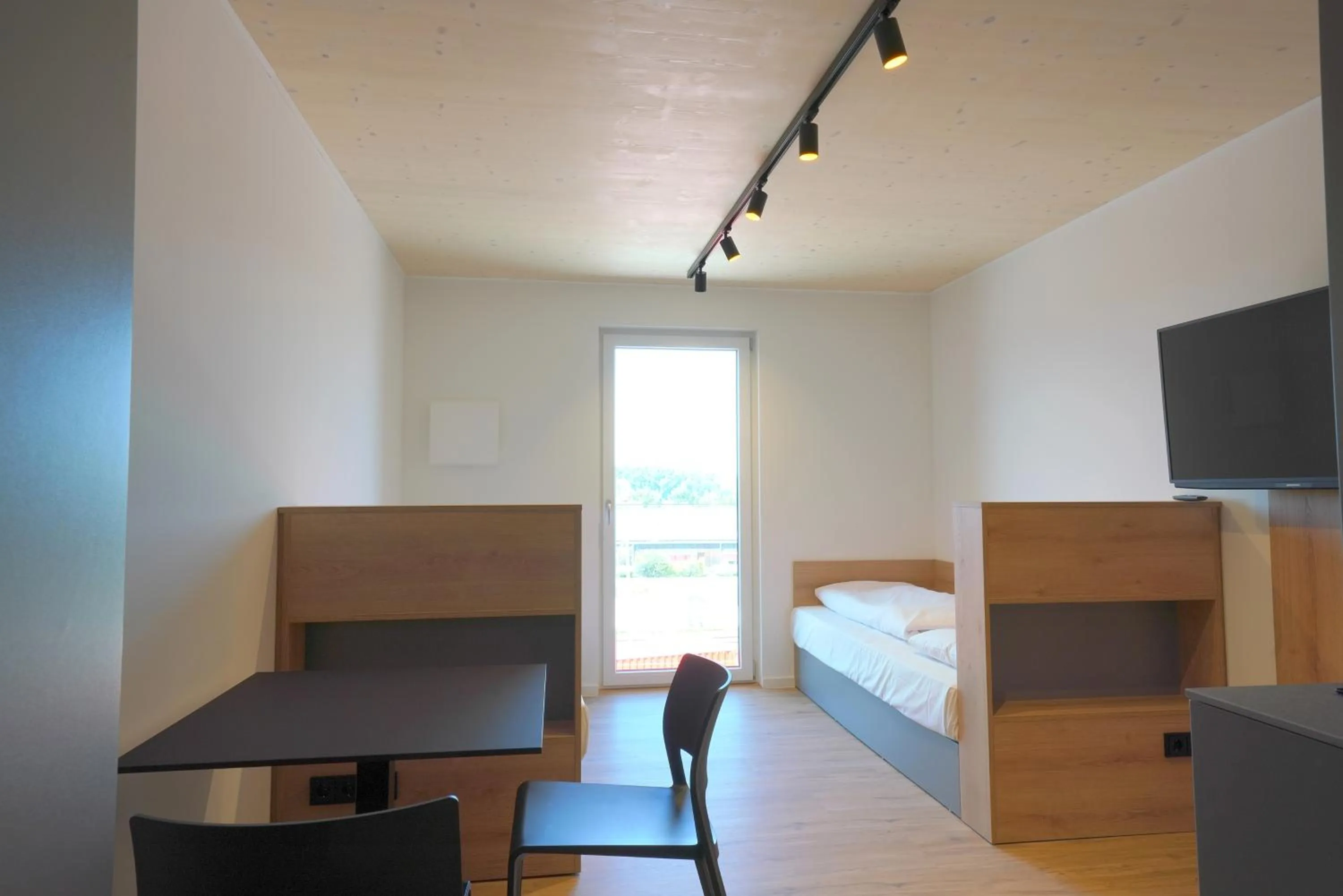 Photo of the whole room, Bed in Timber One Boardinghouse Dorfen