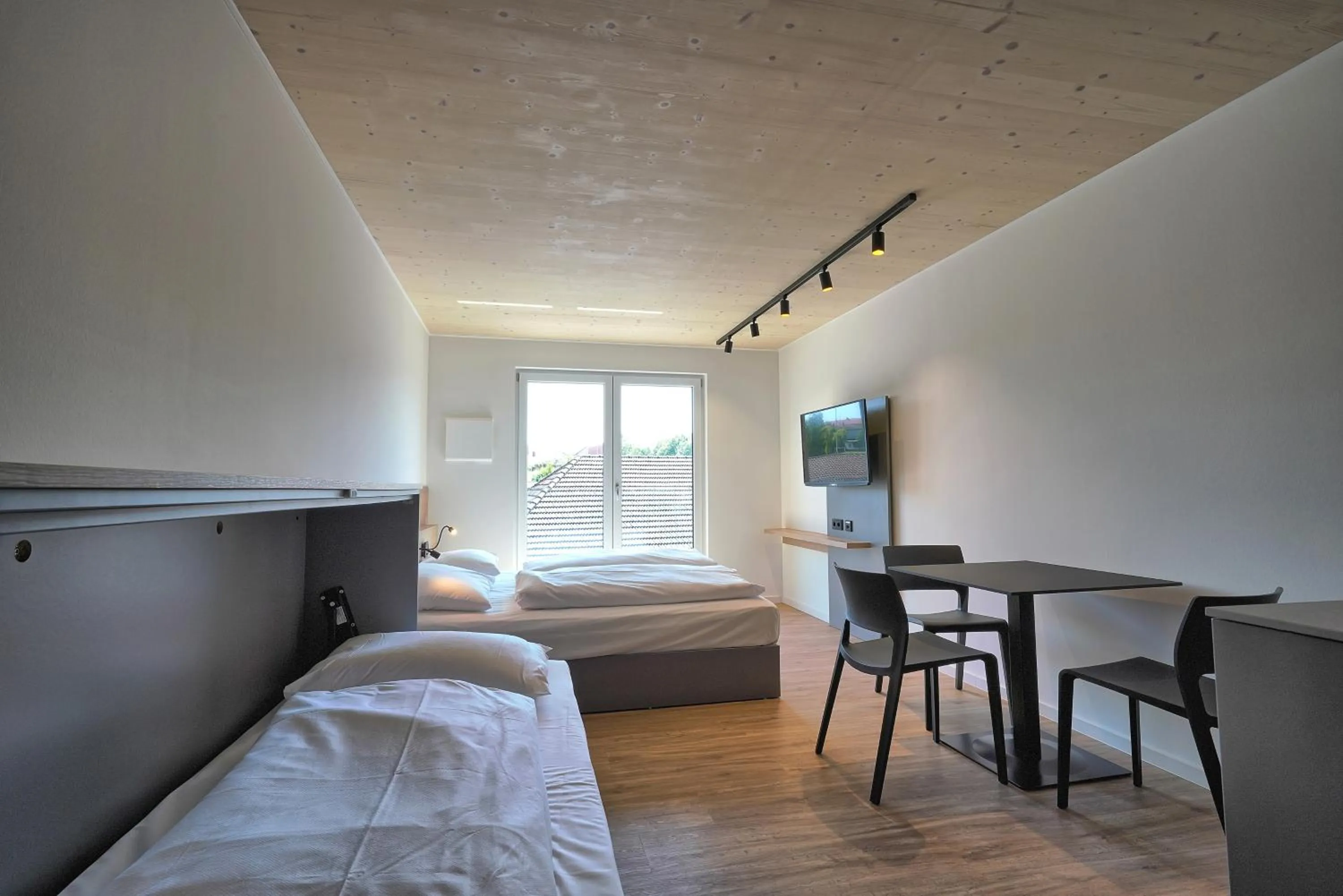 Photo of the whole room, Bed in Timber One Boardinghouse Dorfen