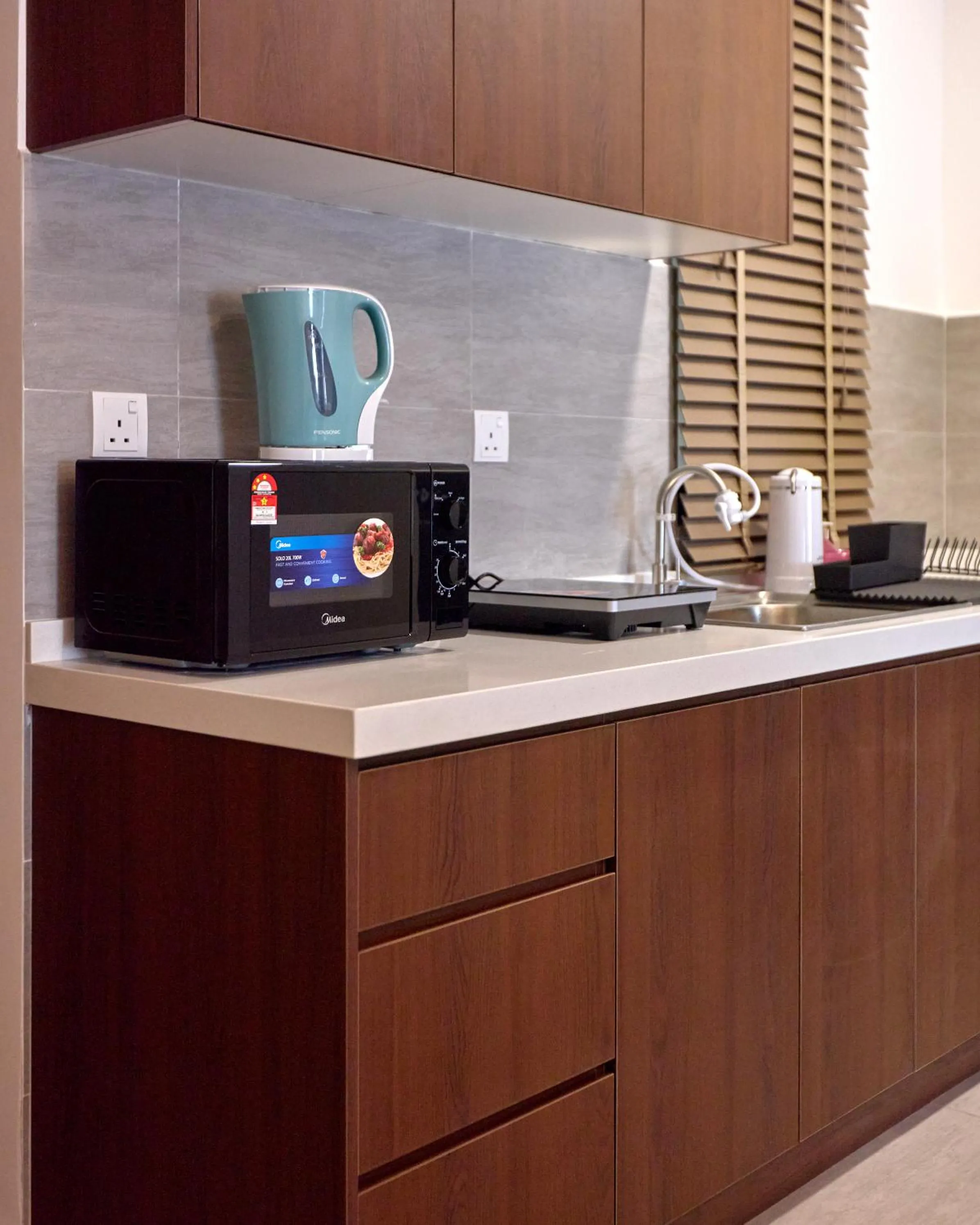 Kitchen or kitchenette in Sunsuria Forum SOHO & Residence Suites Setia Alam by MOKA