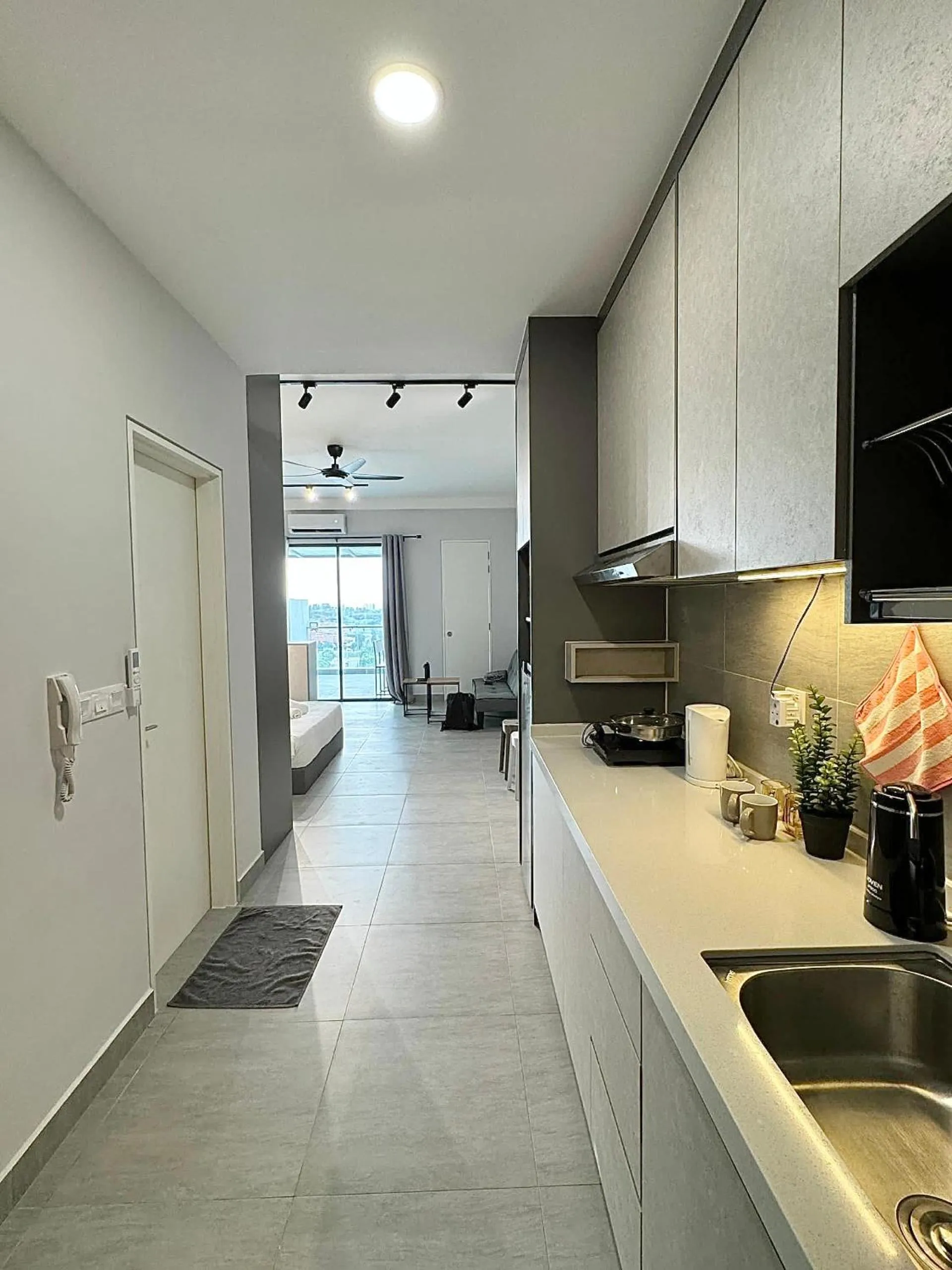 Kitchen or kitchenette in Sunsuria Forum SOHO & Residence Suites Setia Alam by MOKA