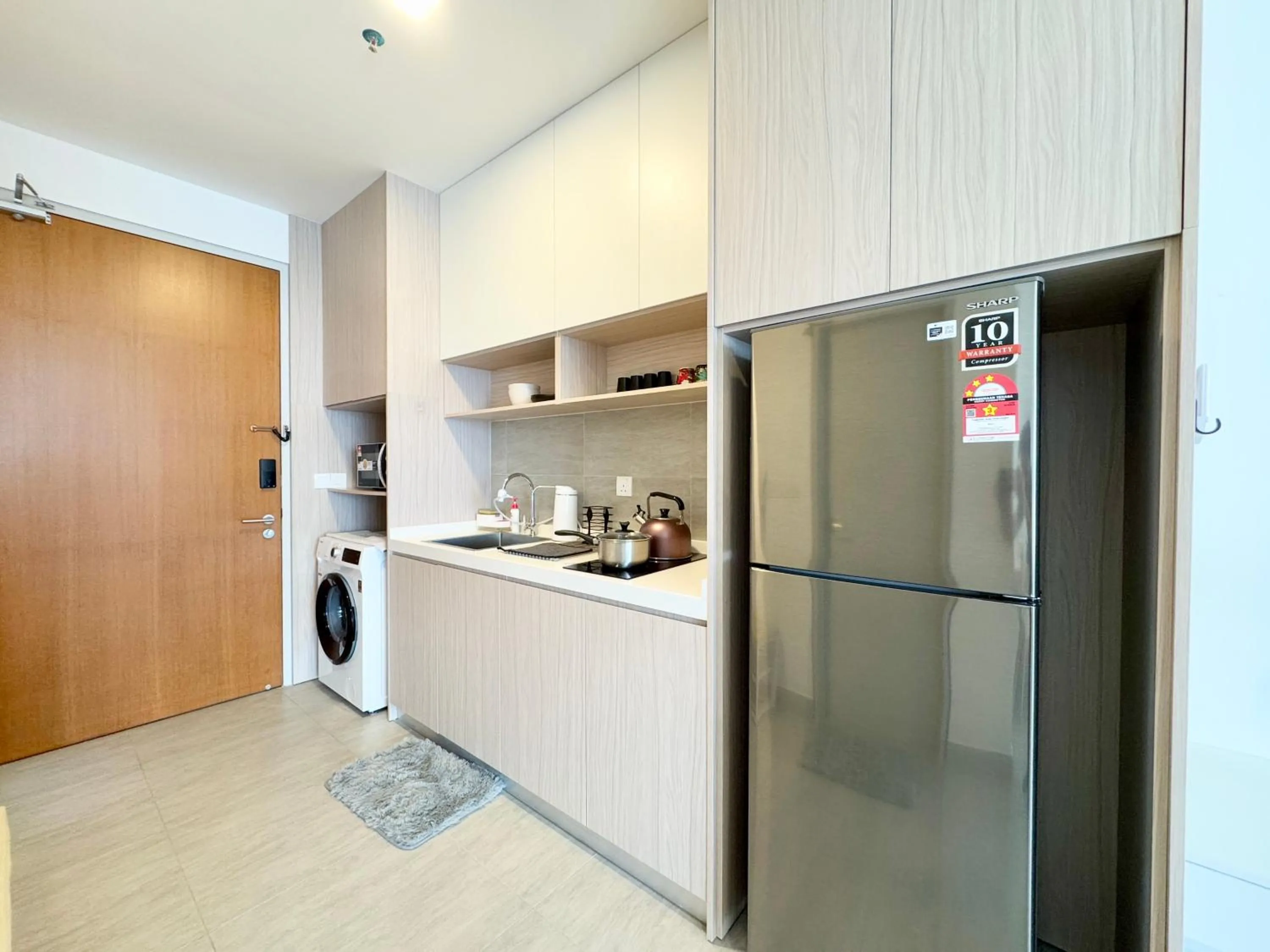 Kitchen or kitchenette in Sunsuria Forum SOHO & Residence Suites Setia Alam by MOKA