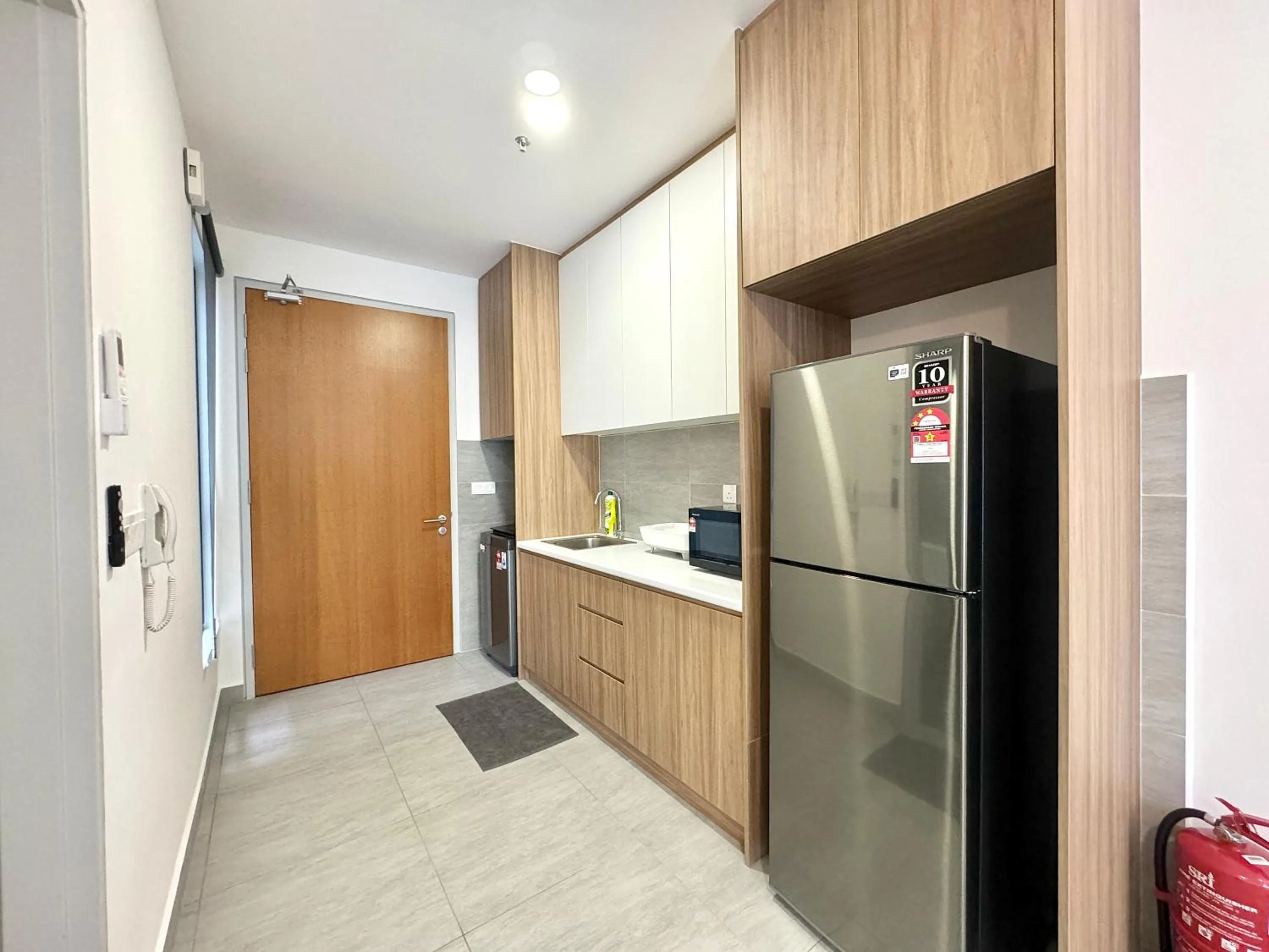 Kitchen or kitchenette in Sunsuria Forum SOHO & Residence Suites Setia Alam by MOKA