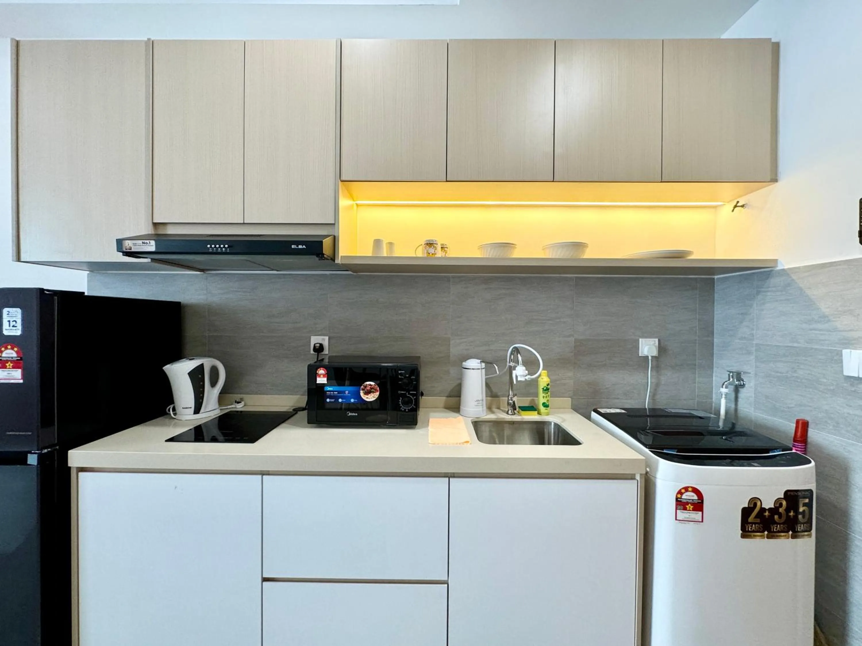 Kitchen or kitchenette in Sunsuria Forum SOHO & Residence Suites Setia Alam by MOKA