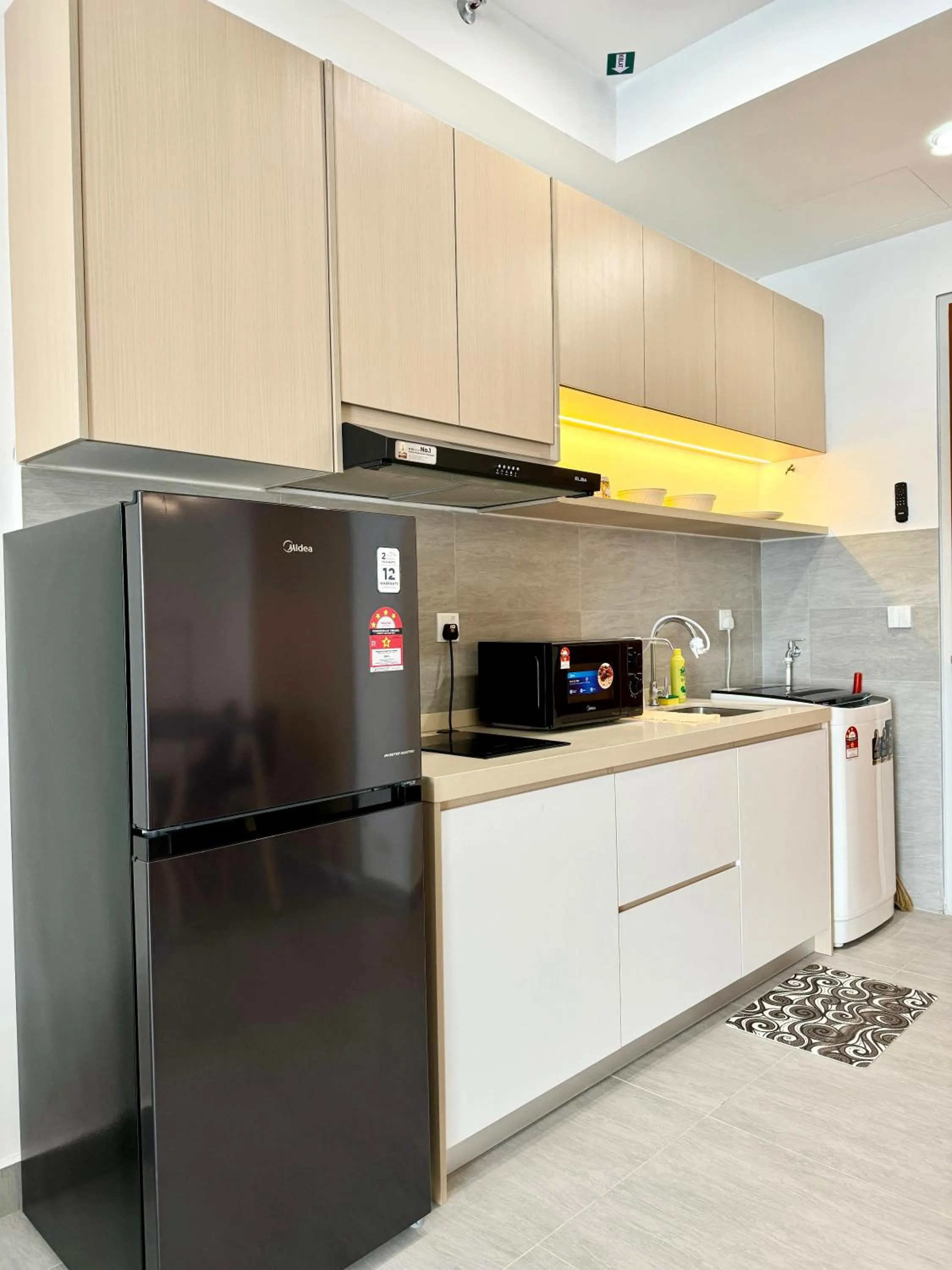 Kitchen or kitchenette in Sunsuria Forum SOHO & Residence Suites Setia Alam by MOKA