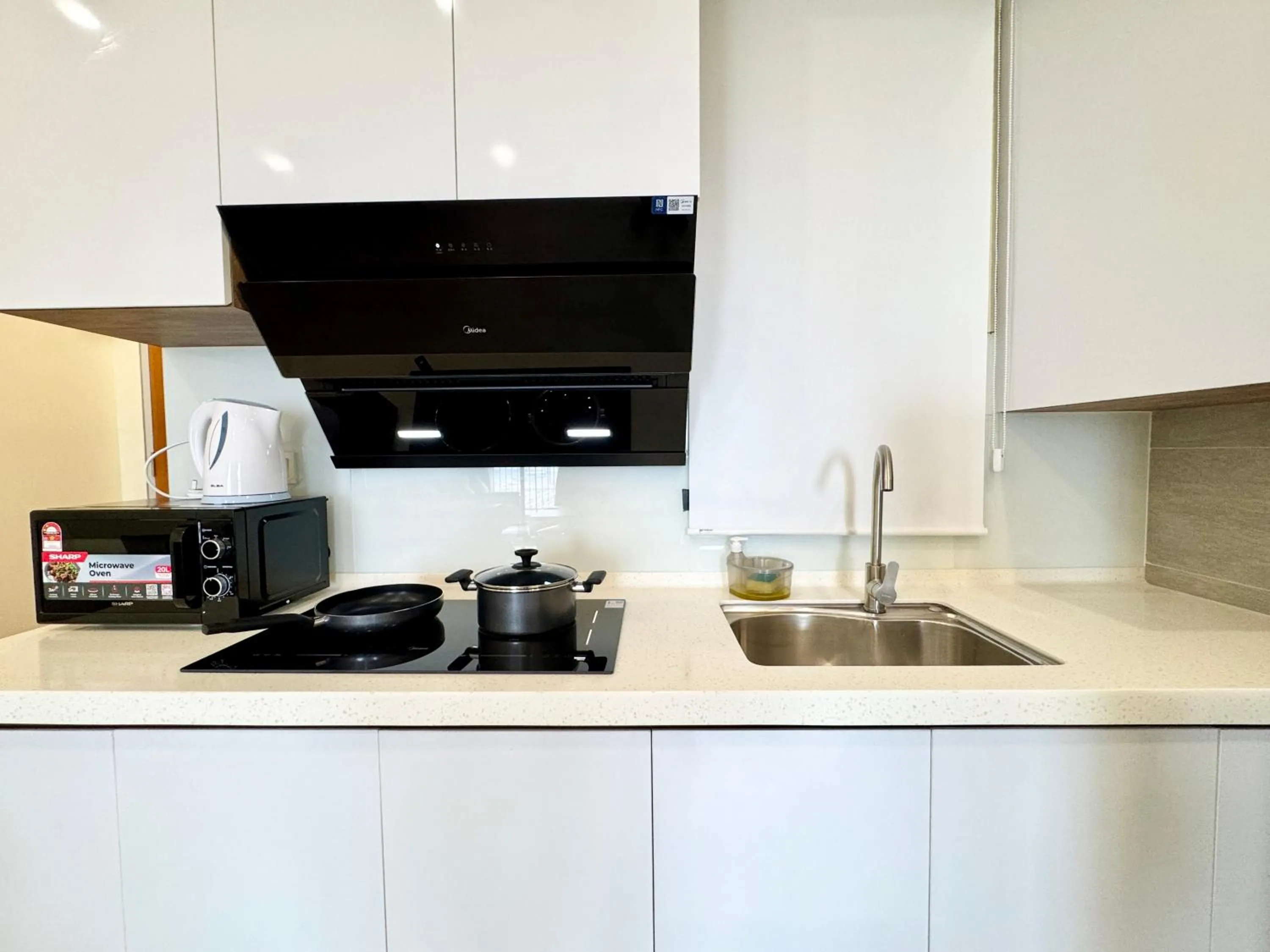 Kitchen or kitchenette in Sunsuria Forum SOHO & Residence Suites Setia Alam by MOKA