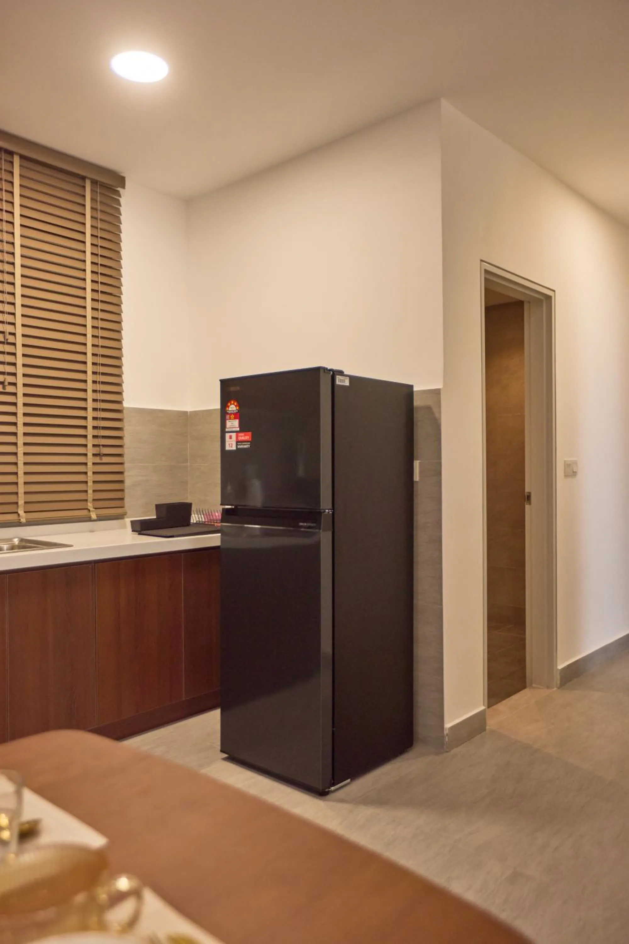 Kitchen or kitchenette in Sunsuria Forum SOHO & Residence Suites Setia Alam by MOKA