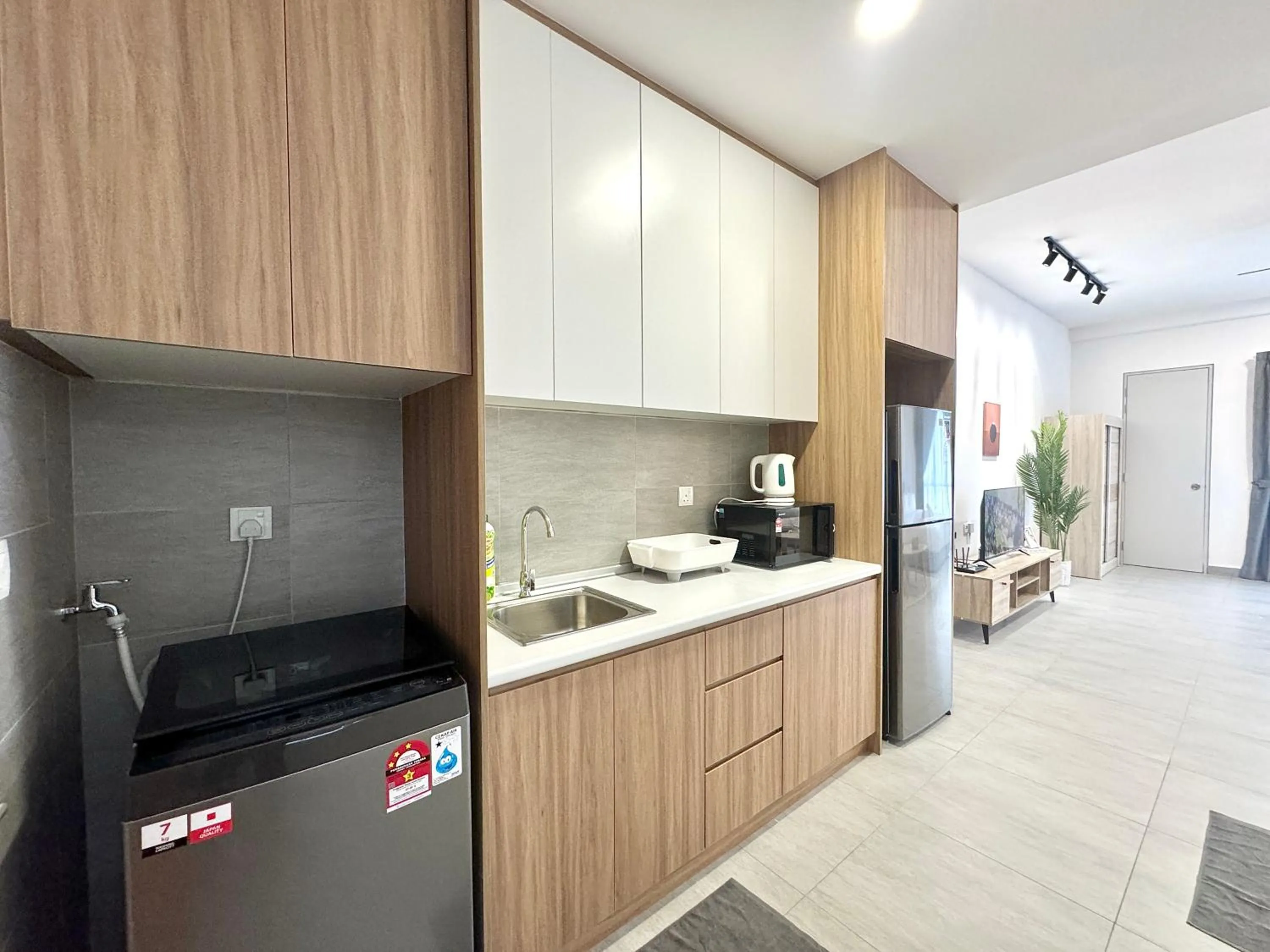 Kitchen or kitchenette in Sunsuria Forum SOHO & Residence Suites Setia Alam by MOKA