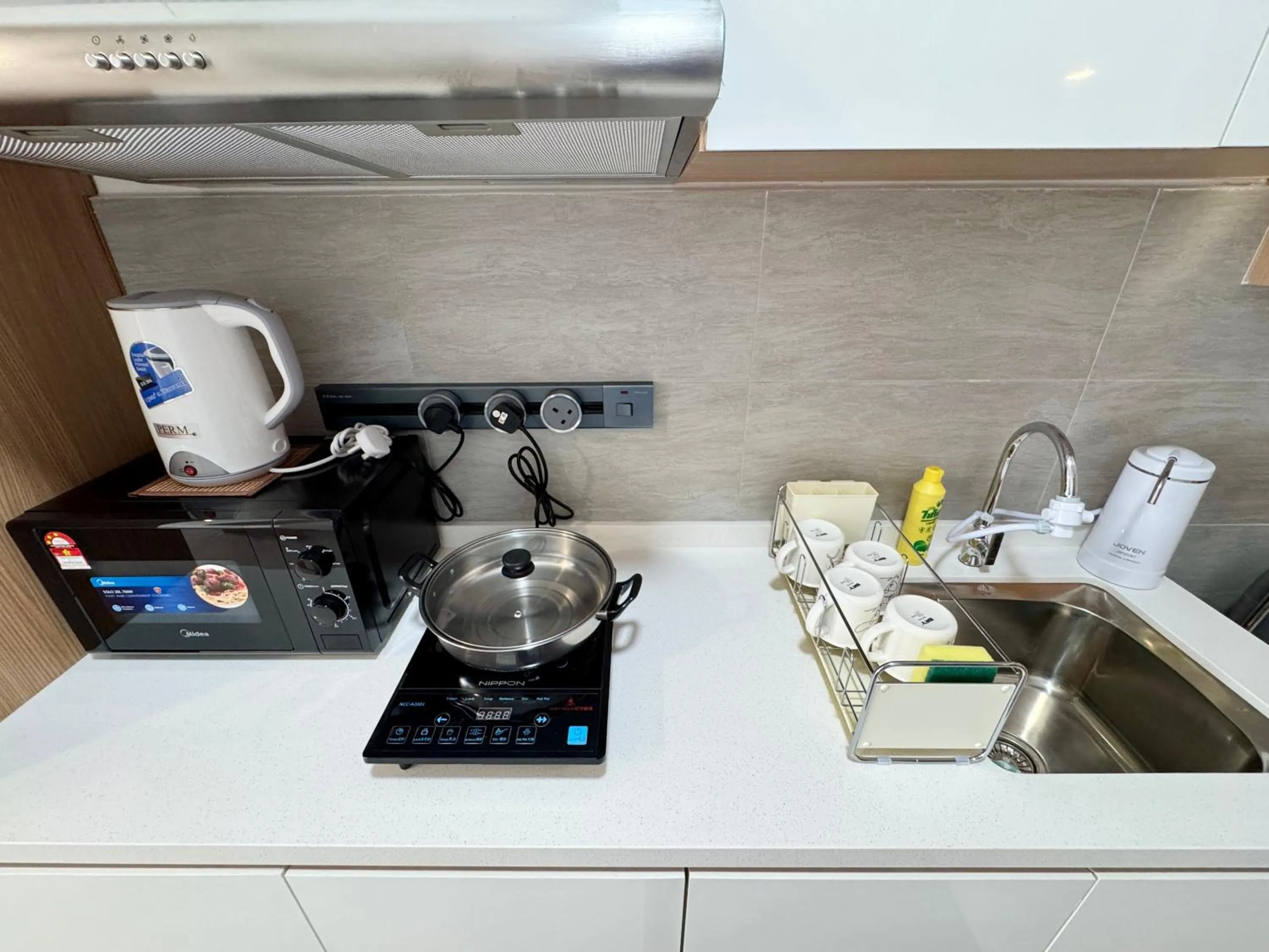 Kitchen or kitchenette in Sunsuria Forum SOHO & Residence Suites Setia Alam by MOKA