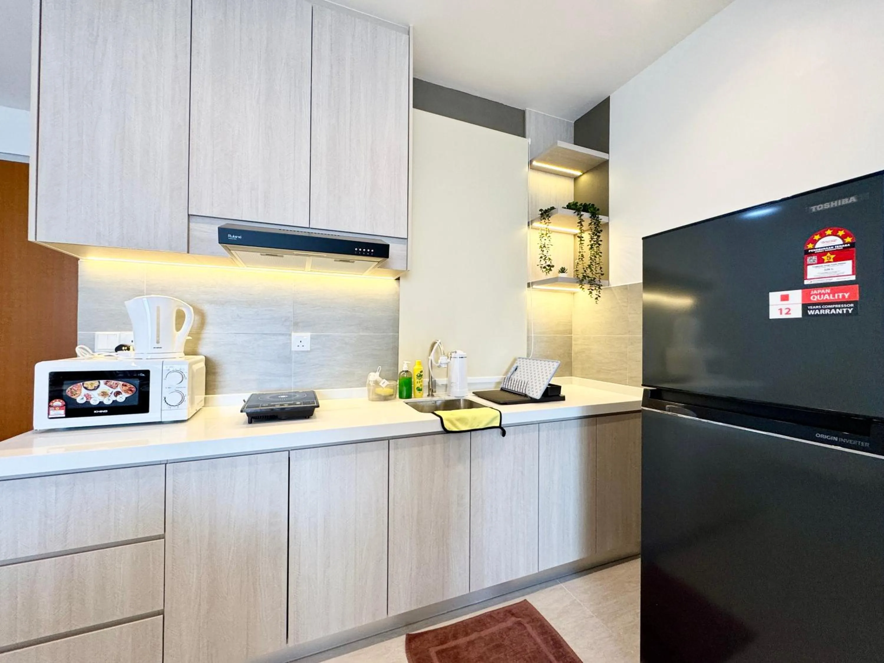Kitchen or kitchenette in Sunsuria Forum SOHO & Residence Suites Setia Alam by MOKA