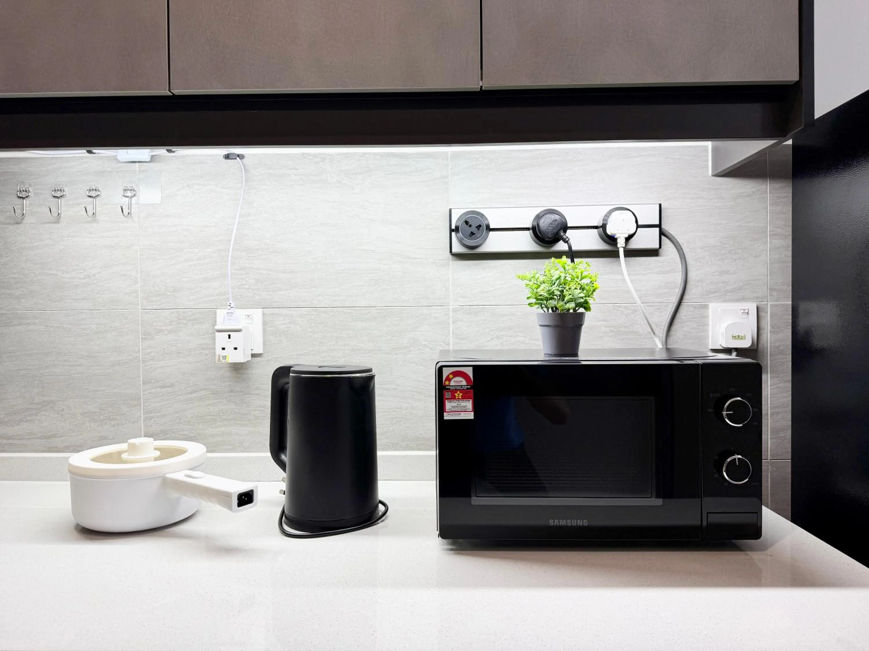 Kitchen or kitchenette in Sunsuria Forum SOHO & Residence Suites Setia Alam by MOKA