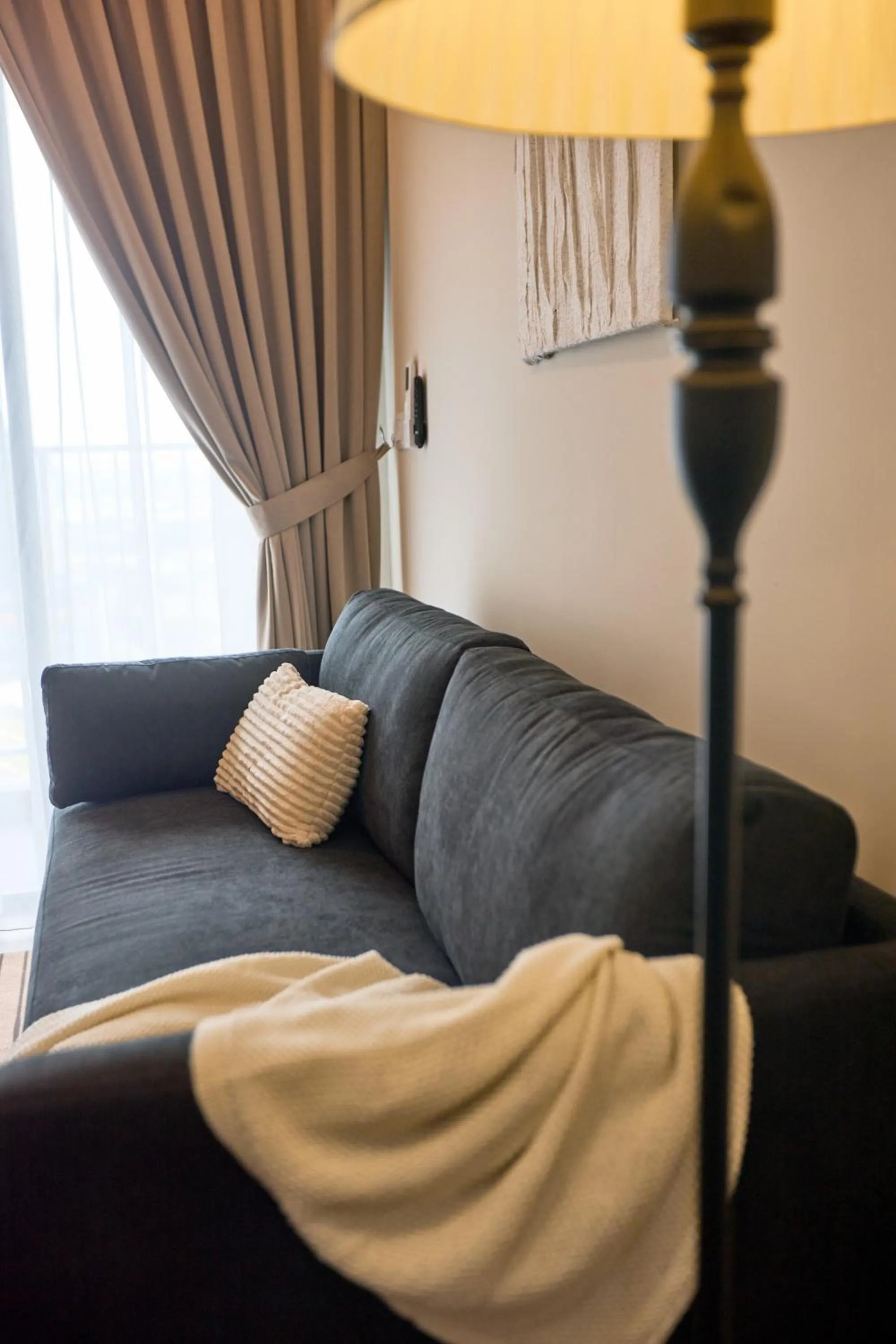 Living room in Sunsuria Forum SOHO & Residence Suites Setia Alam by MOKA