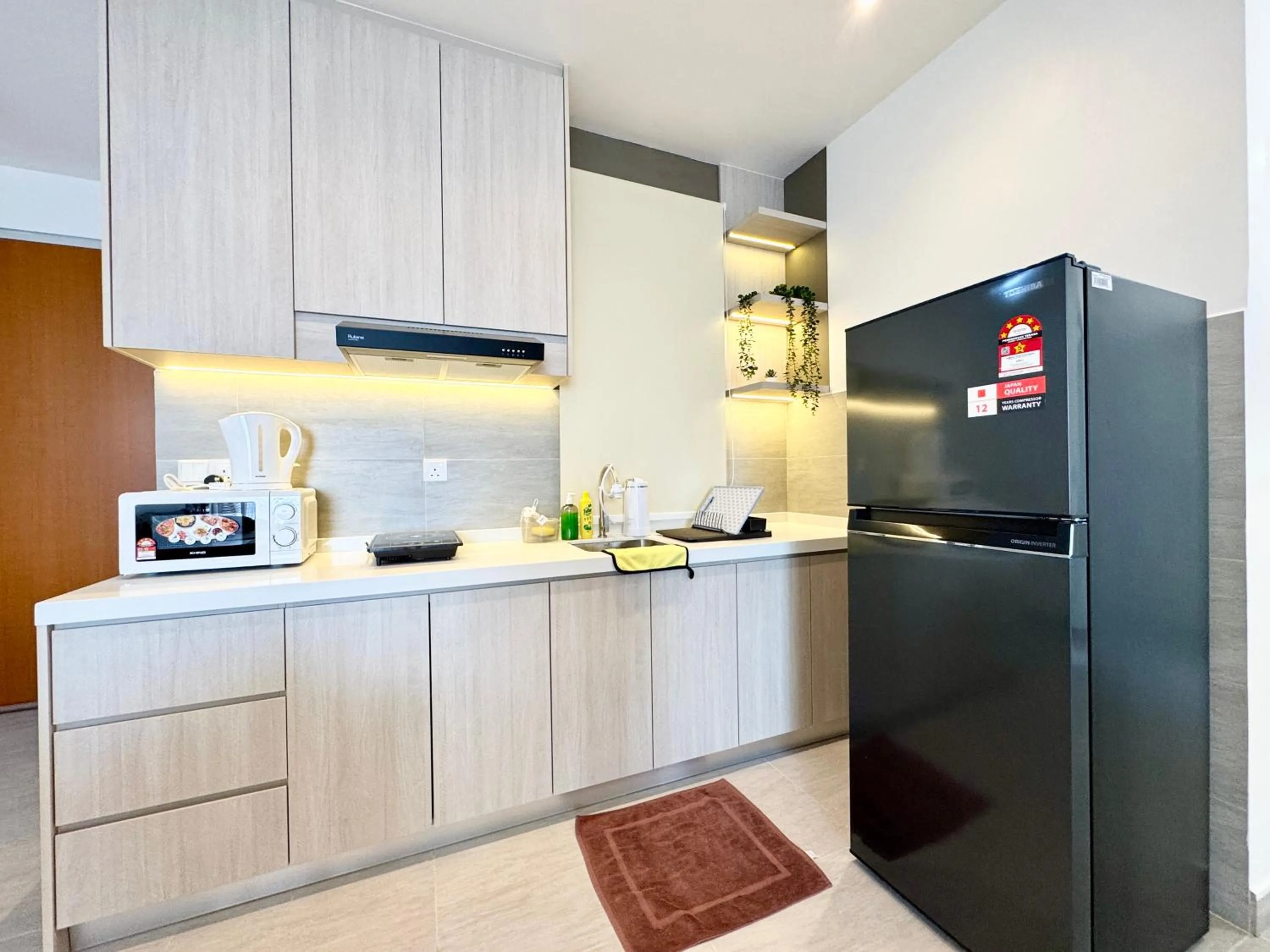 Kitchen or kitchenette in Sunsuria Forum SOHO & Residence Suites Setia Alam by MOKA