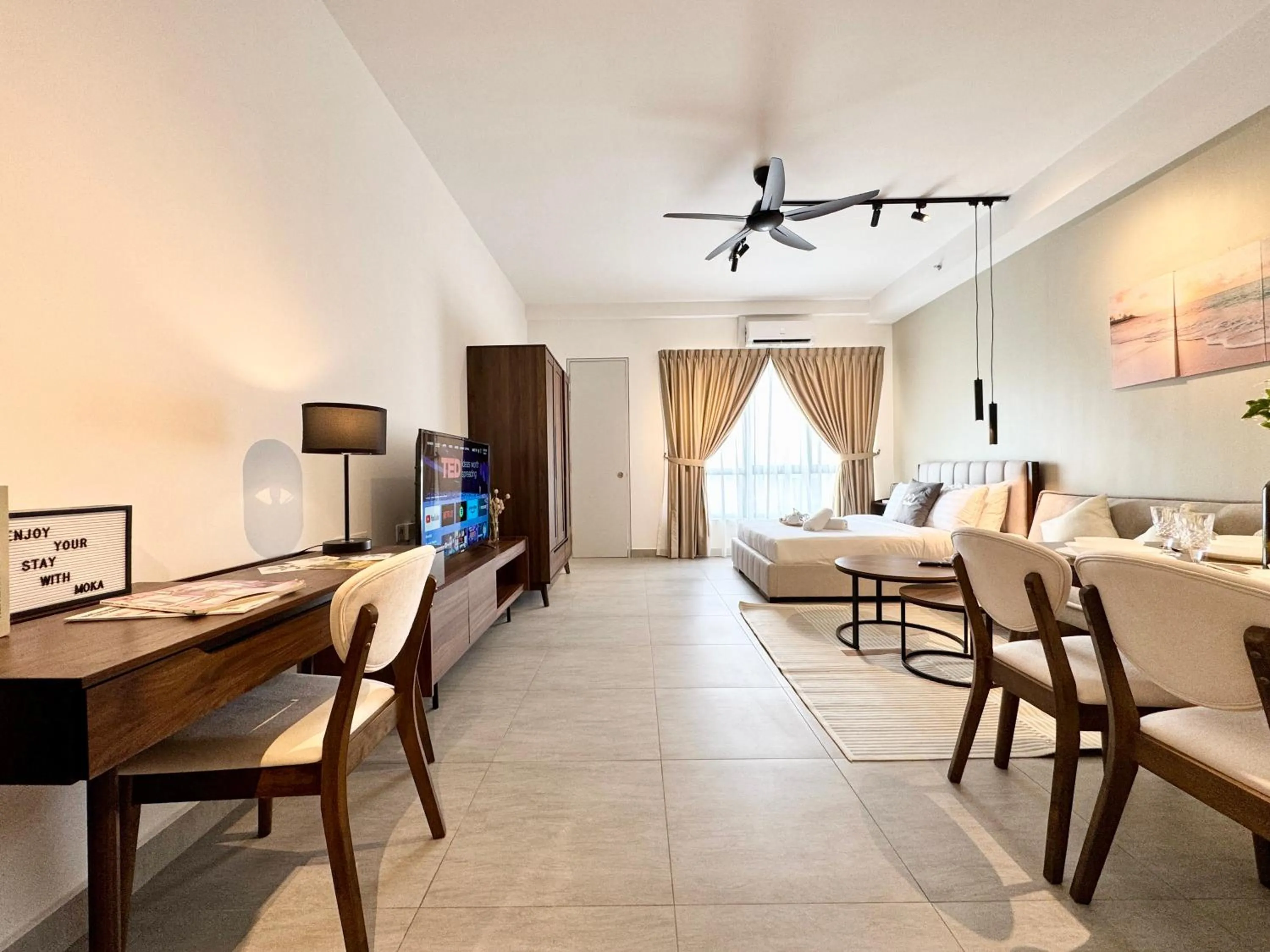 Living room in Sunsuria Forum SOHO & Residence Suites Setia Alam by MOKA