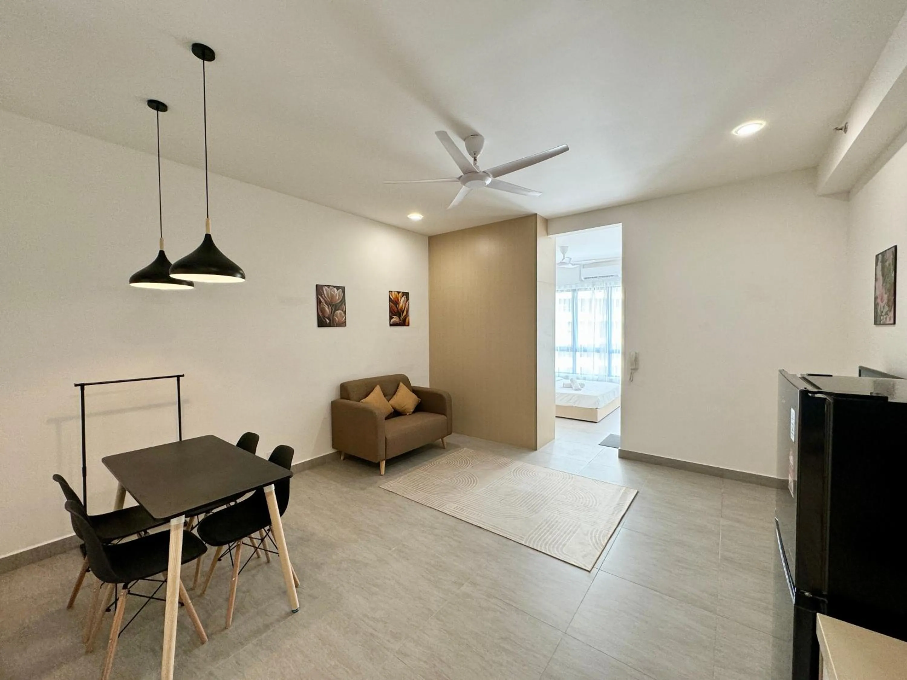 Living room in Sunsuria Forum SOHO & Residence Suites Setia Alam by MOKA