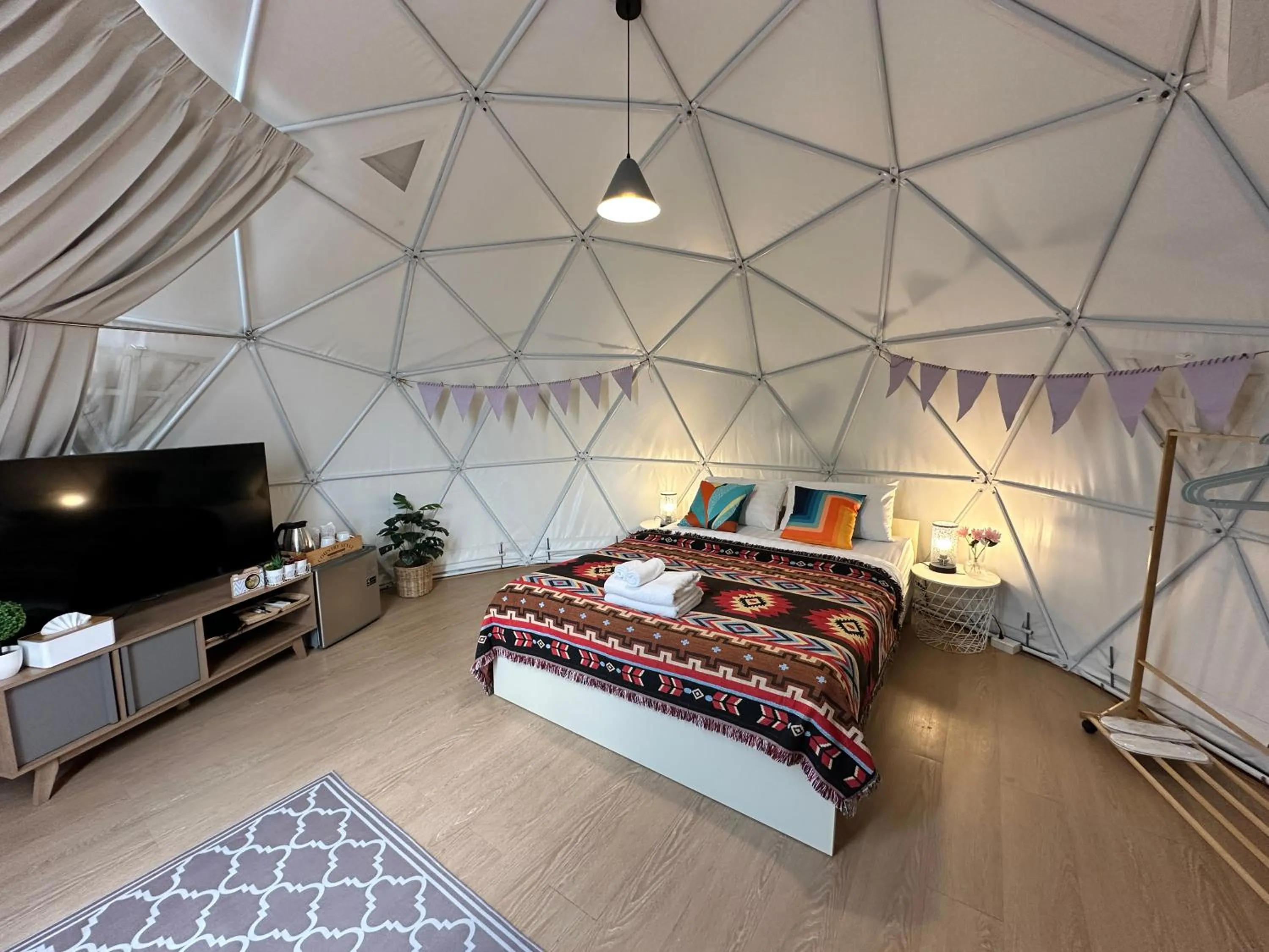 Bed in The Campster Kanchanaburi