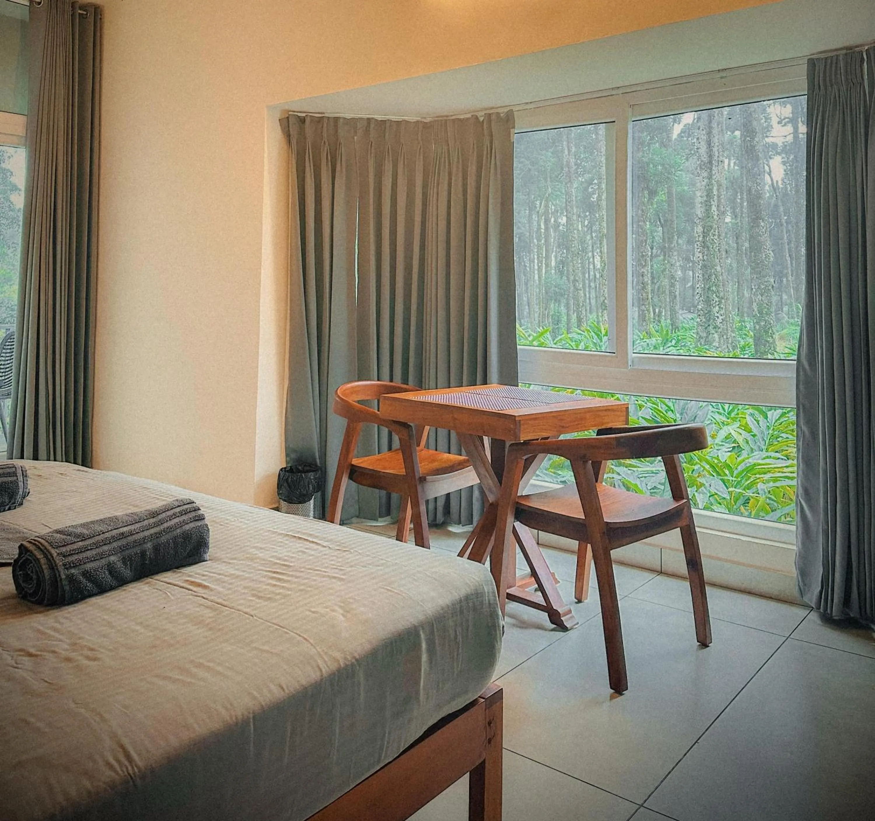 Seating area, Bed in Forestscape Resort Munnar