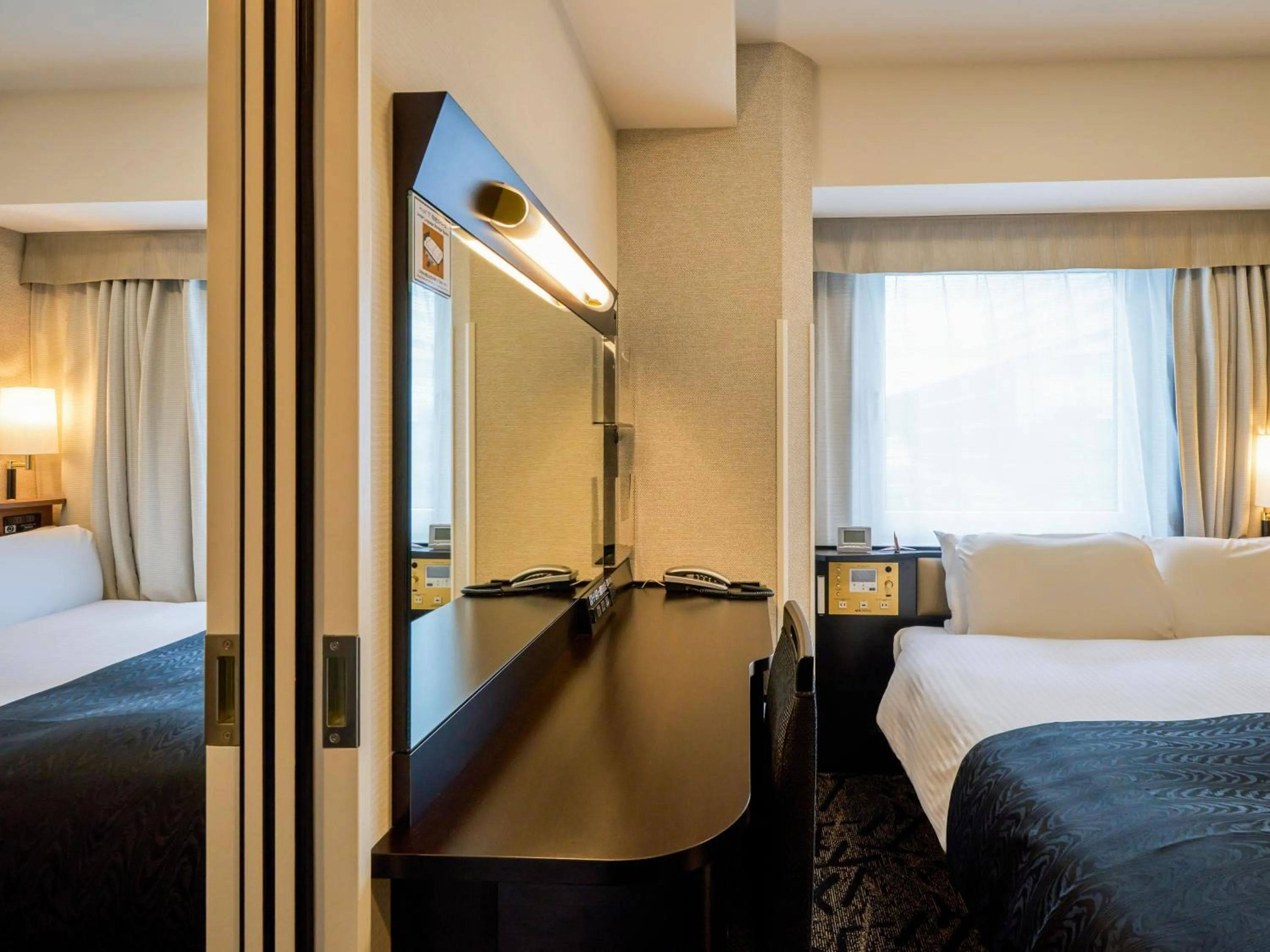 Photo of the whole room, Bed in APA Hotel Hiroshima Ekimae Shinkansenguchi