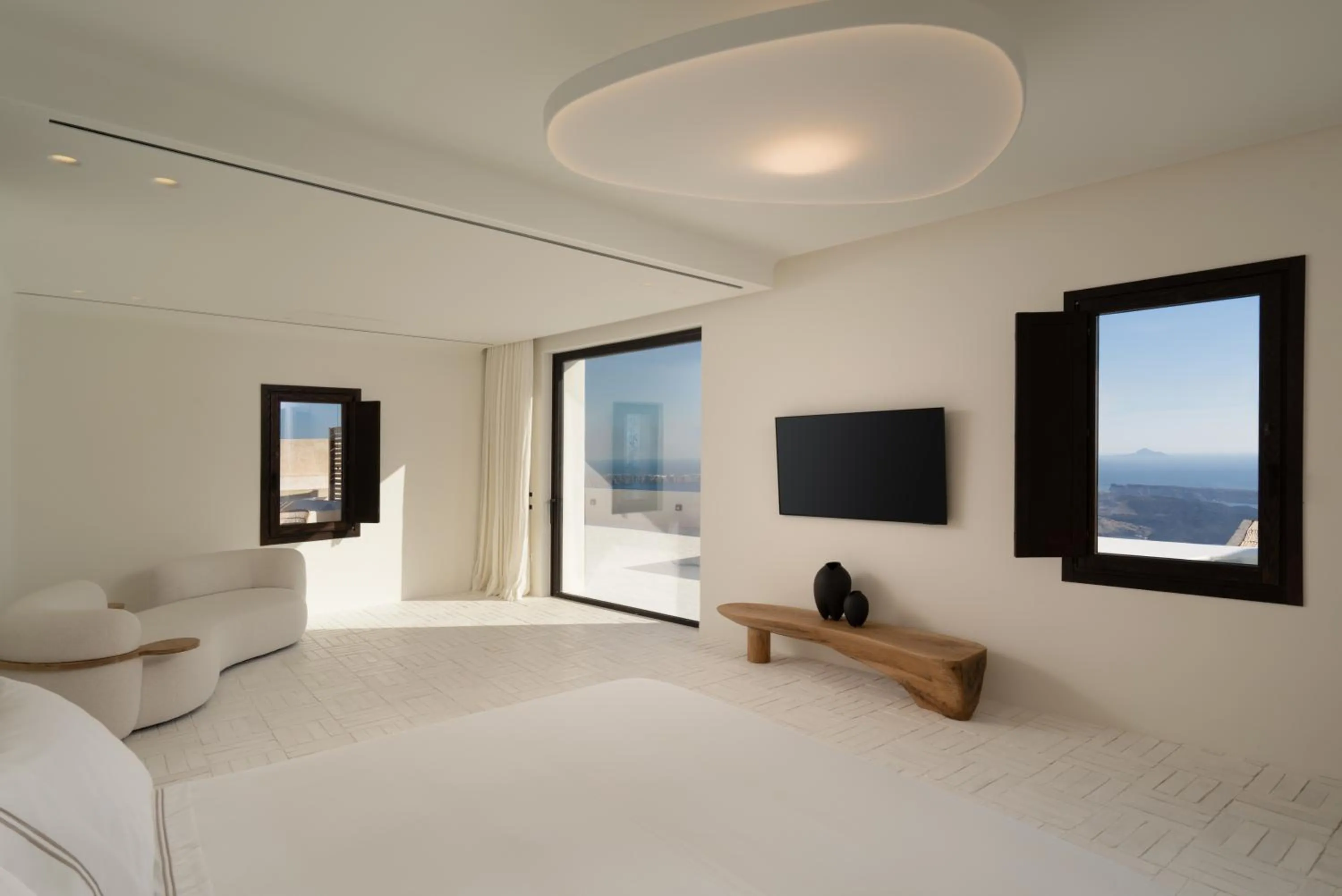 Bed in Katikies Chromata Santorini - The Leading Hotels of the World