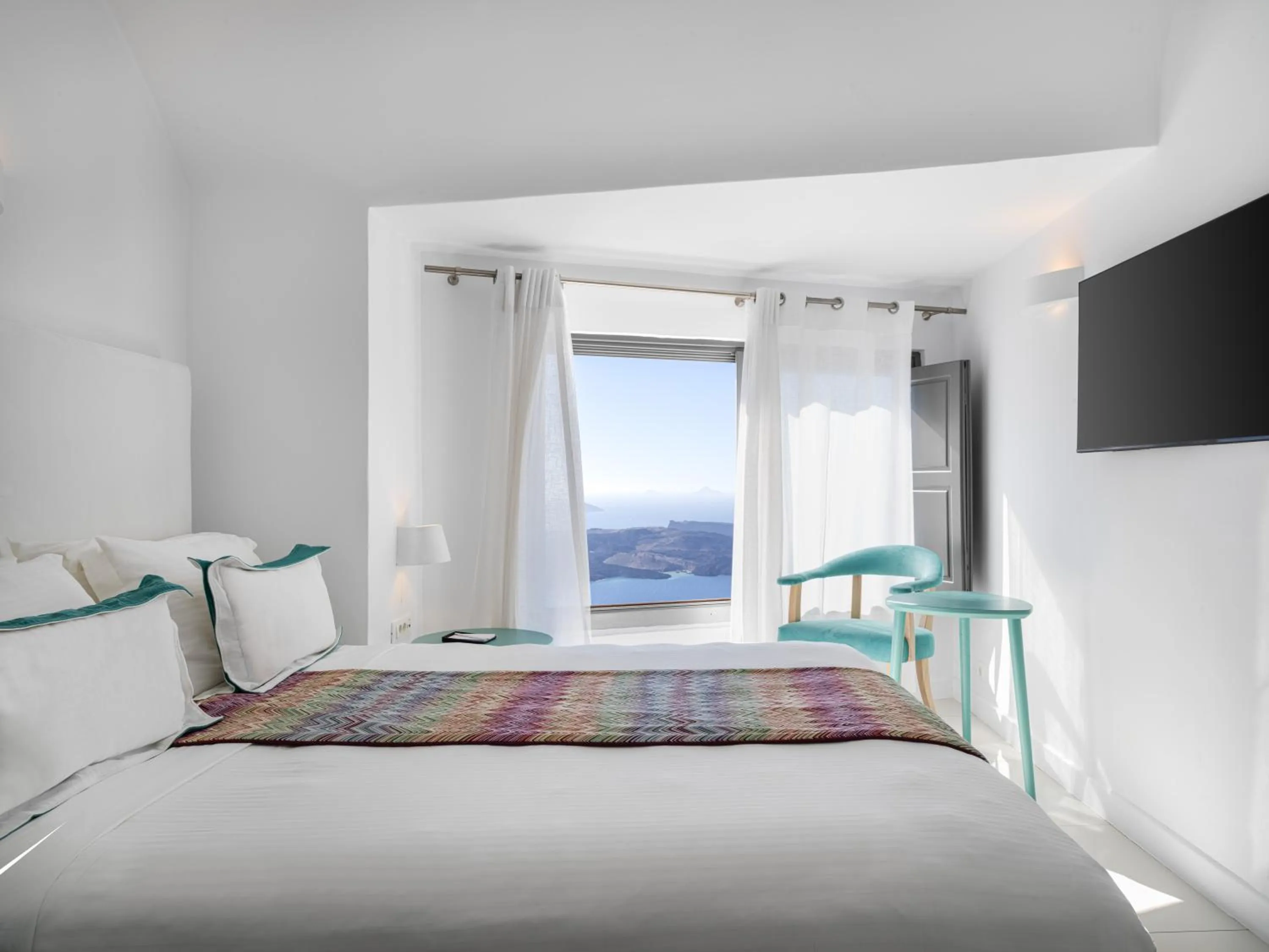 Bed in Katikies Chromata Santorini - The Leading Hotels of the World