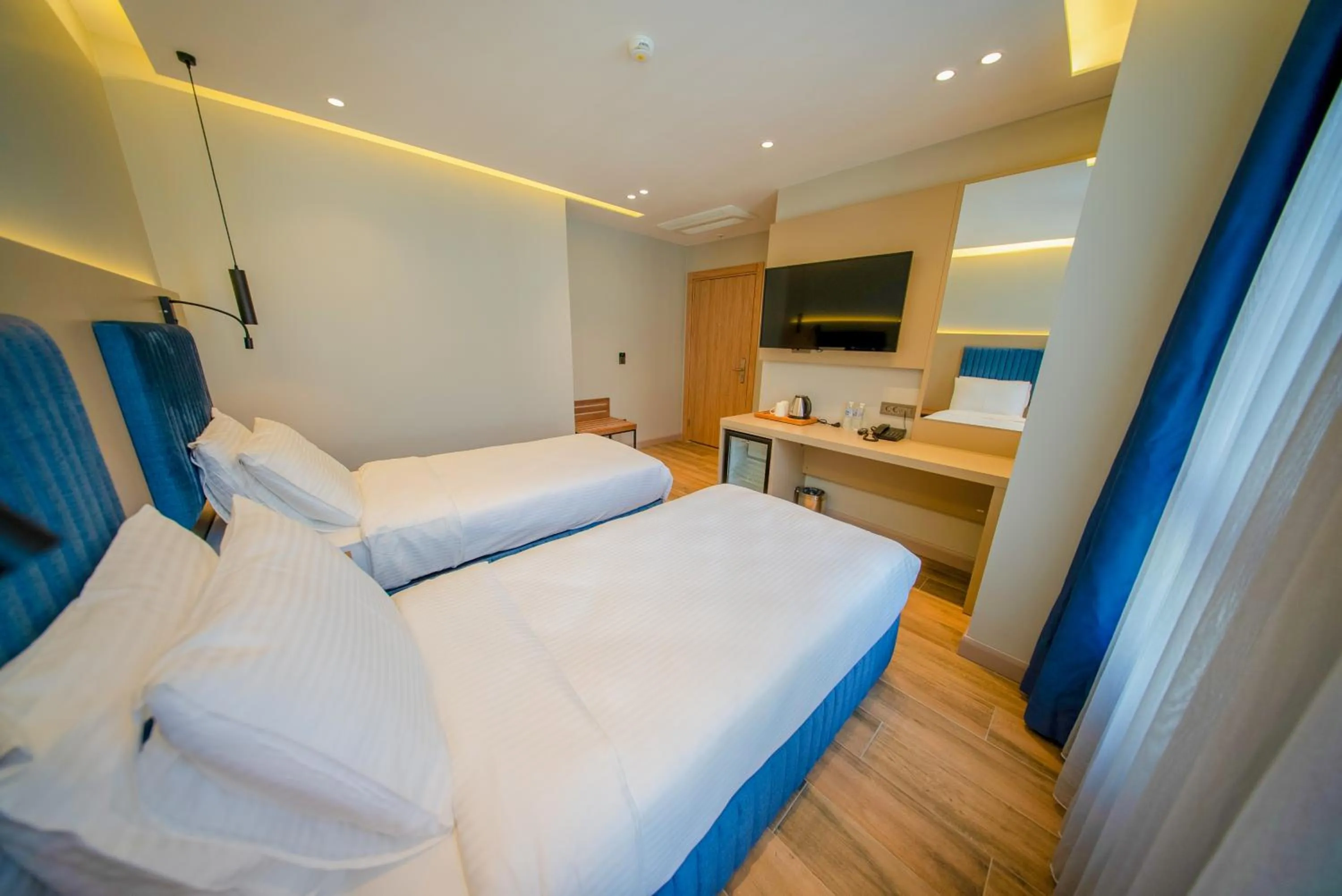 Bed in The Palm Bosphorus Hotel