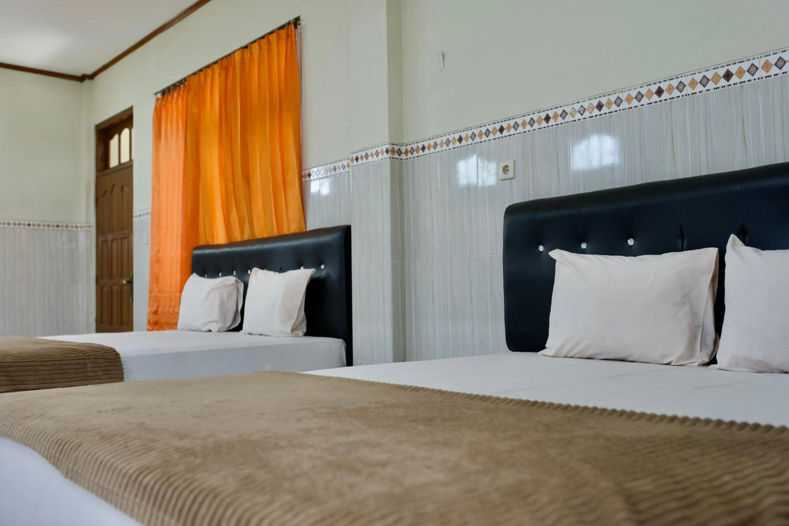 Bed in Garuda Setia Hotel