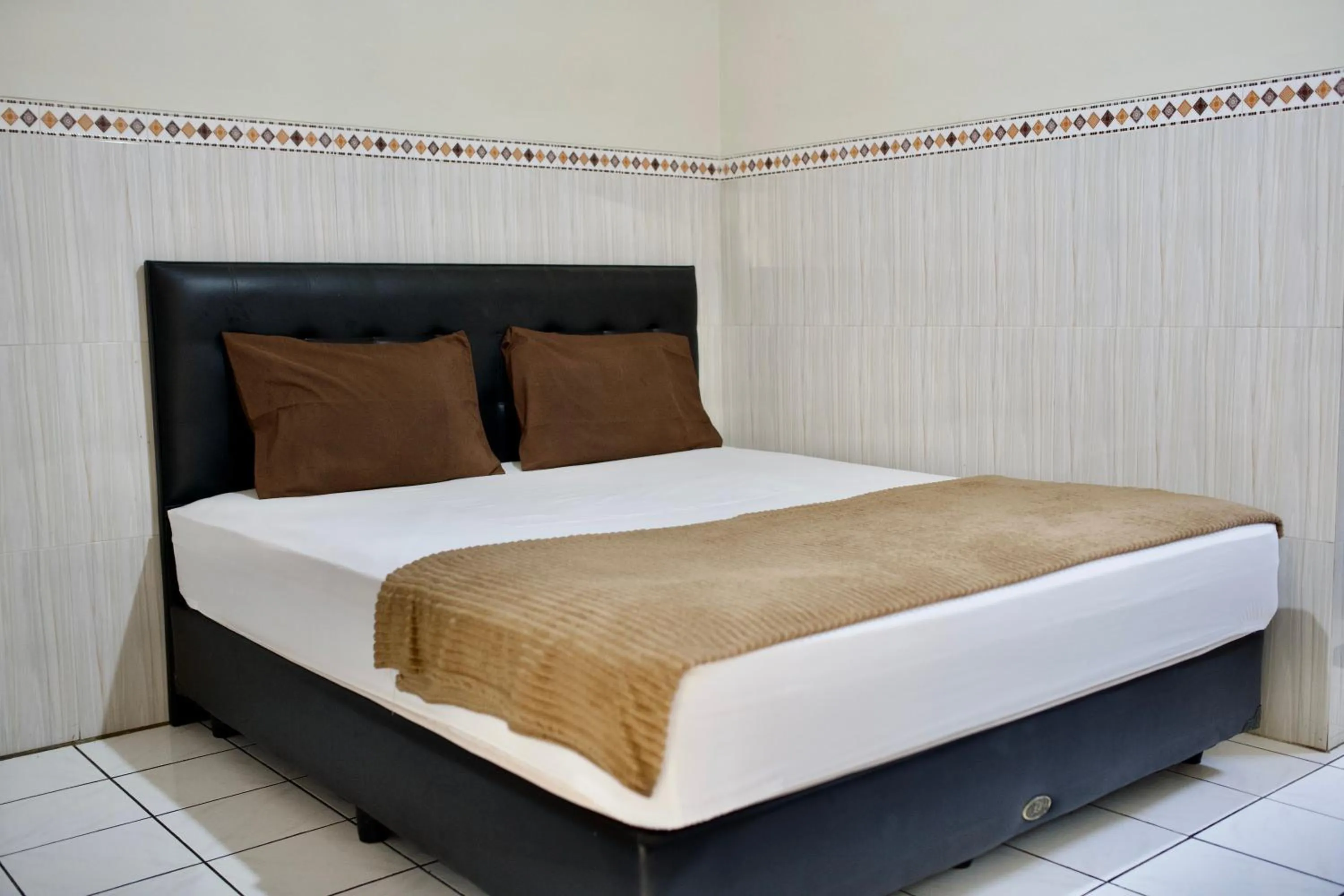 Bed in Garuda Setia Hotel