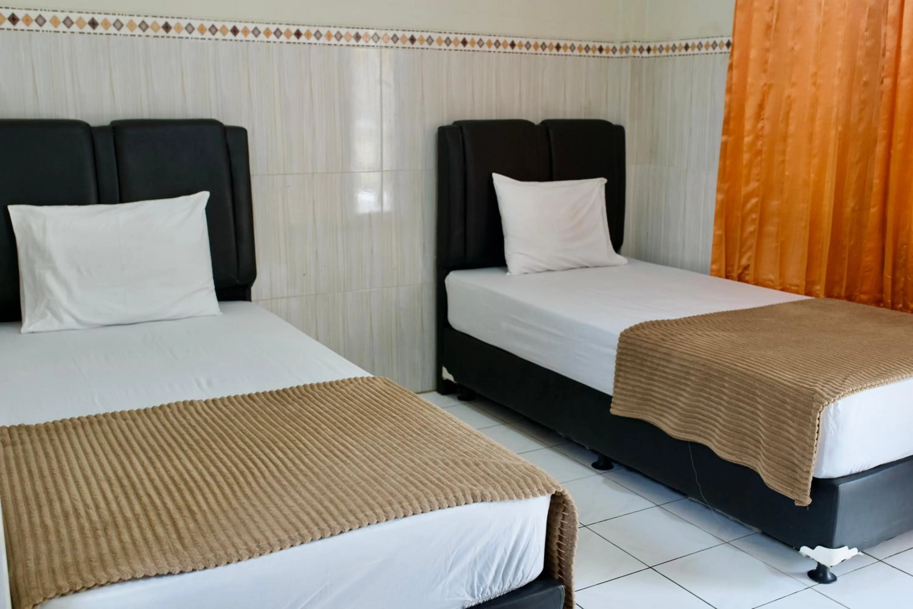 Bed in Garuda Setia Hotel