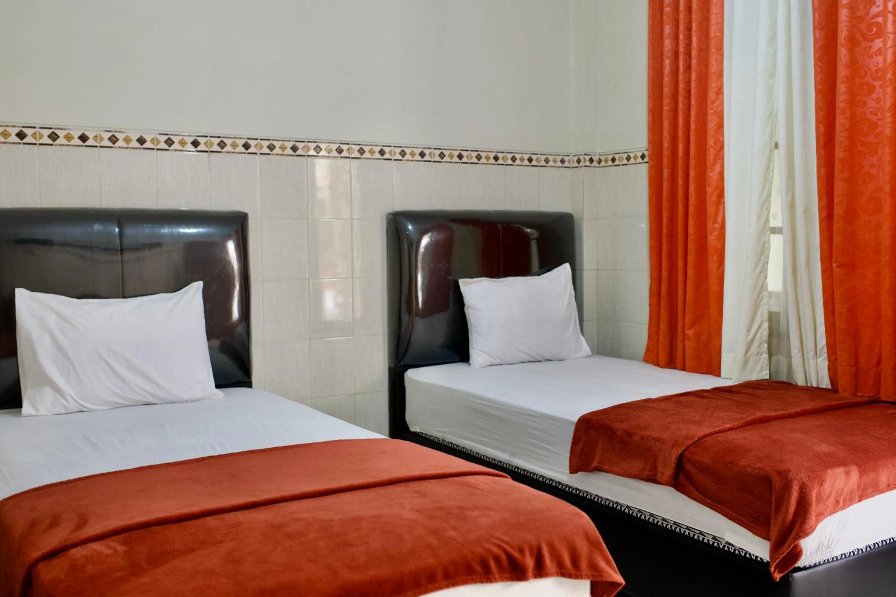 Bed in Garuda Setia Hotel