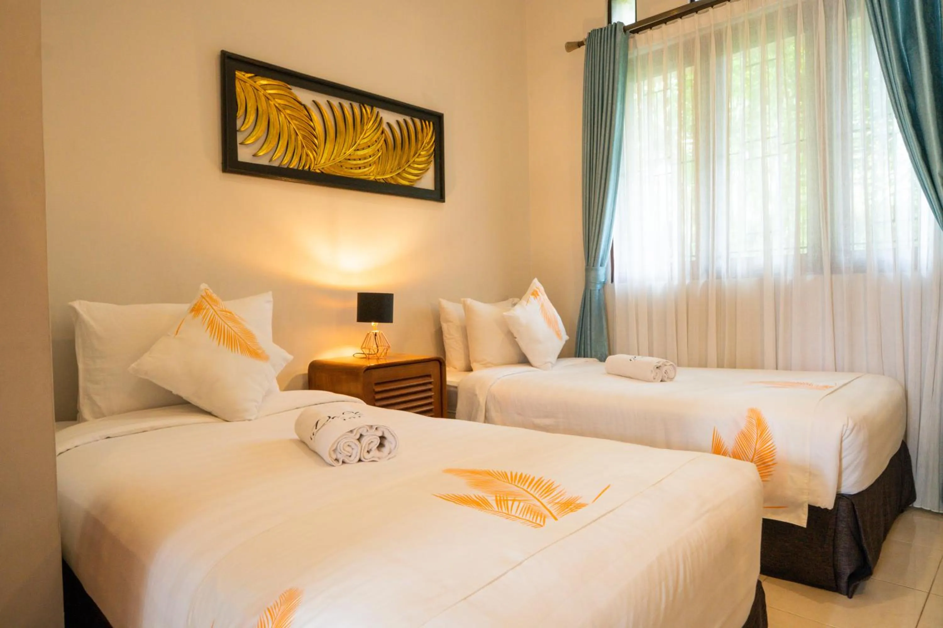 Bed in De Tropen Jogja Villa