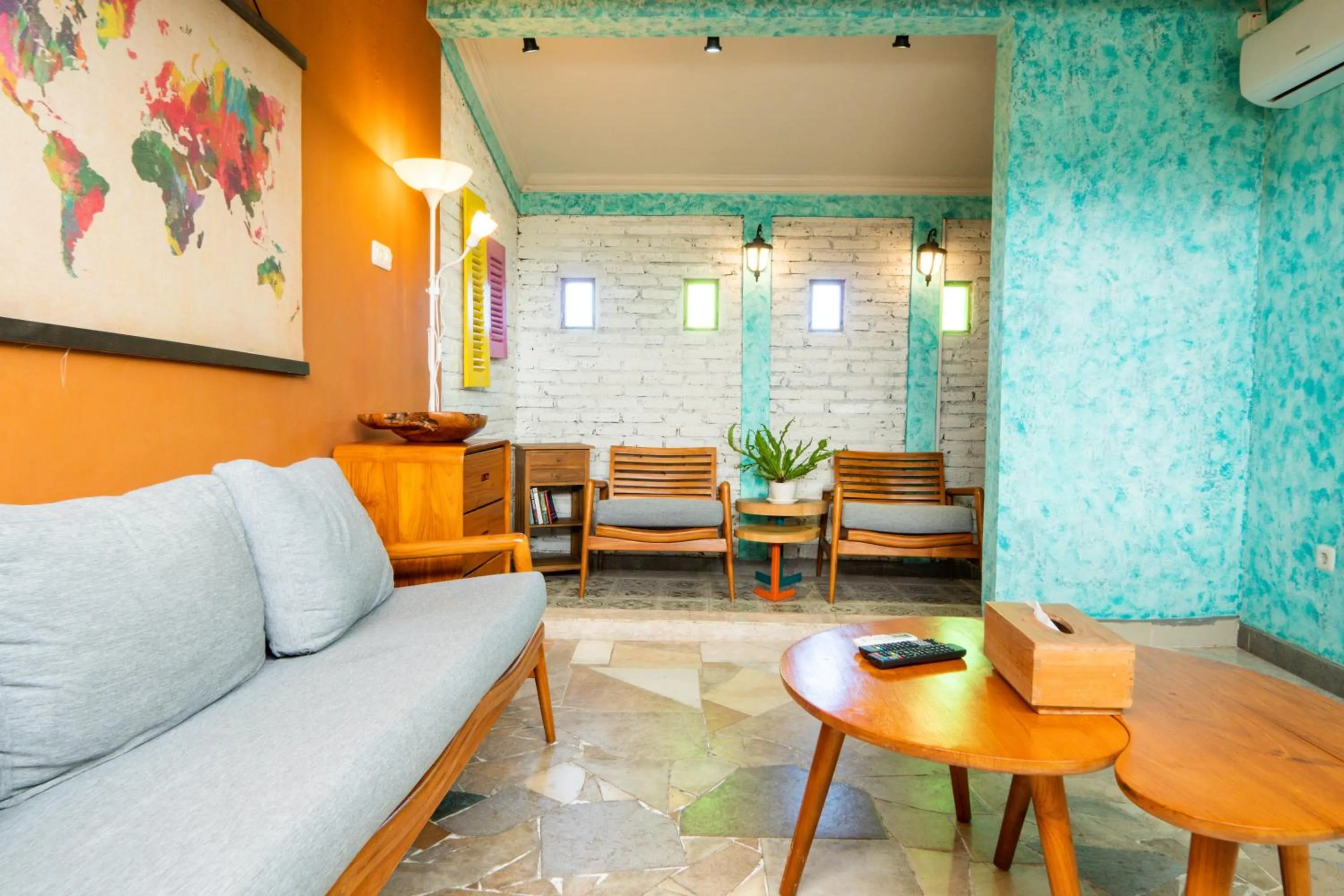 Communal lounge/ TV room in De Tropen Jogja Villa