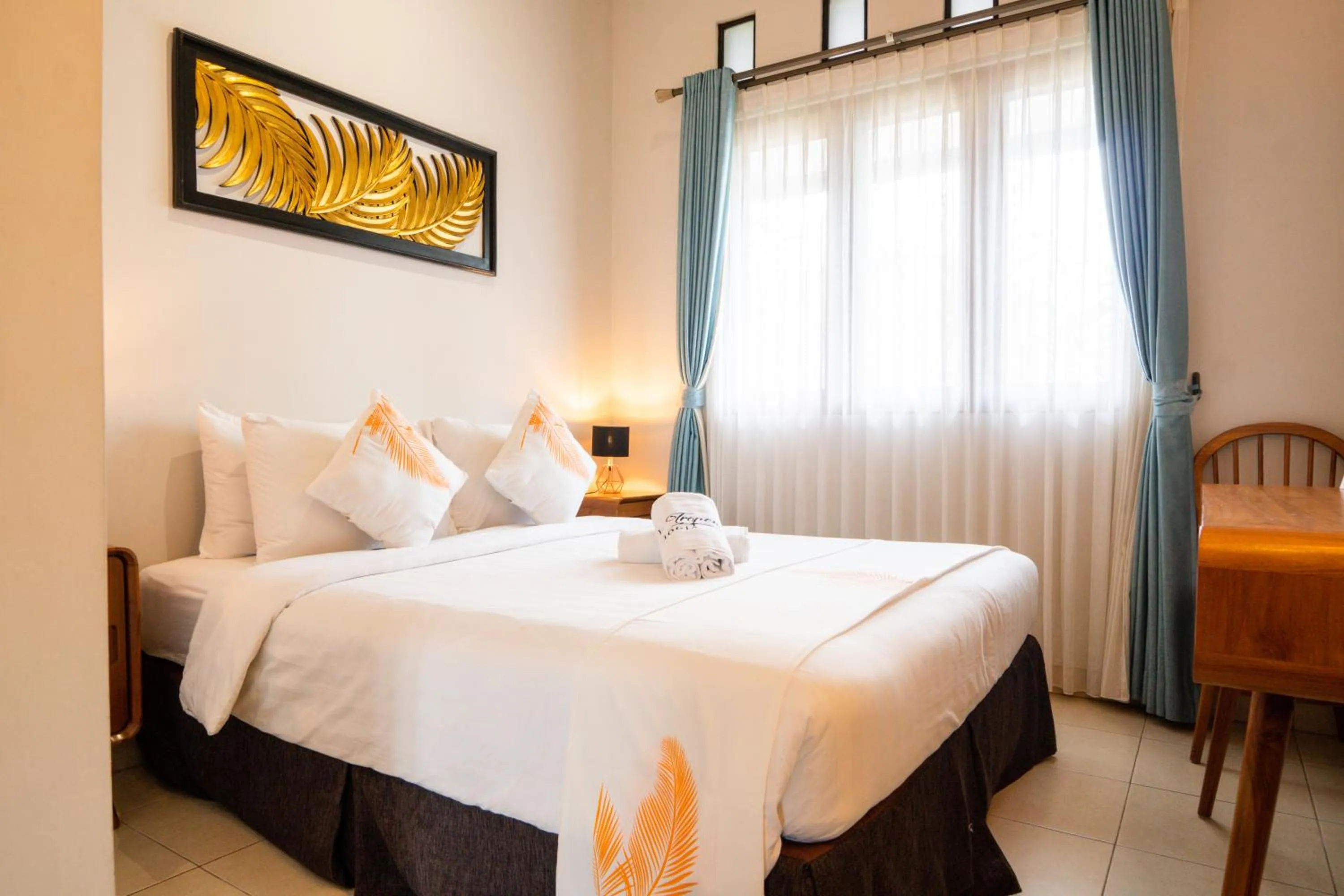 Bed in De Tropen Jogja Villa