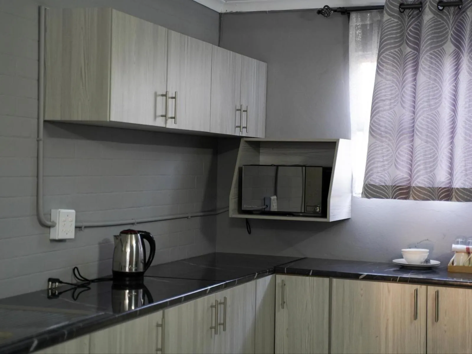Kitchen or kitchenette in Aqua Guest House