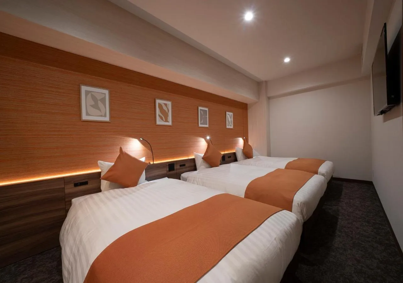 Bed in Nagoya B's Hotel