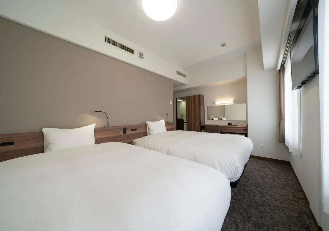 Bed in Nagoya B's Hotel