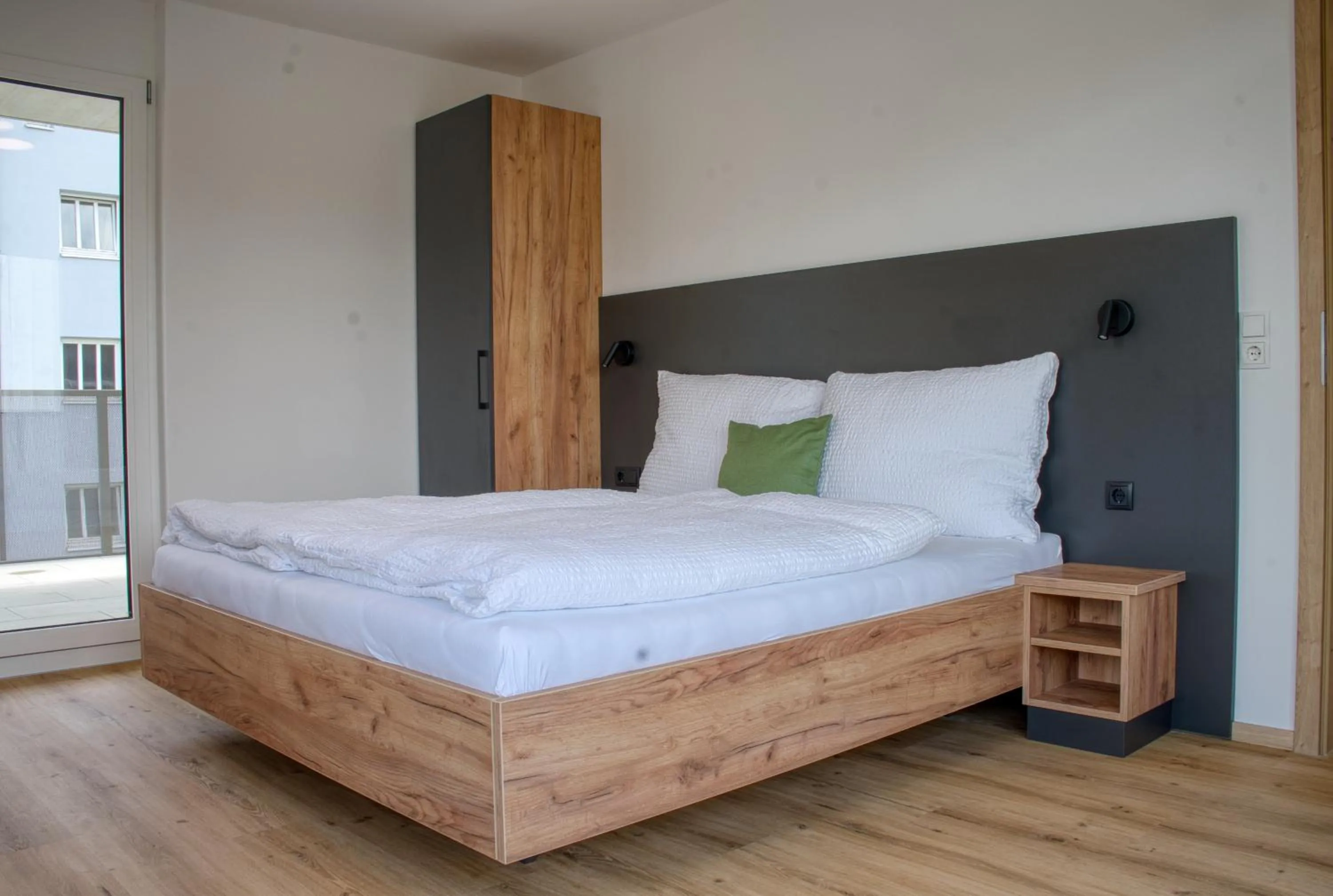 Bed in myQuartier City Chalets digital self check in