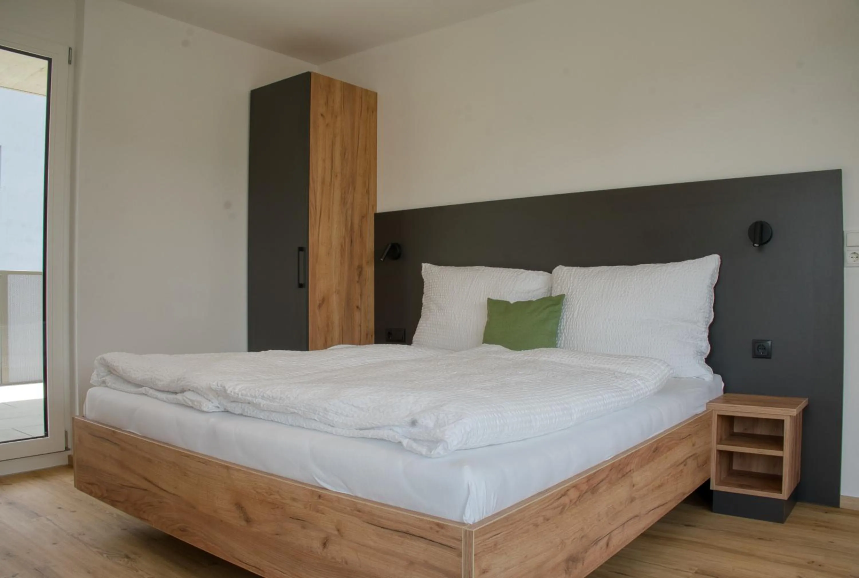 Bed in myQuartier City Chalets digital self check in