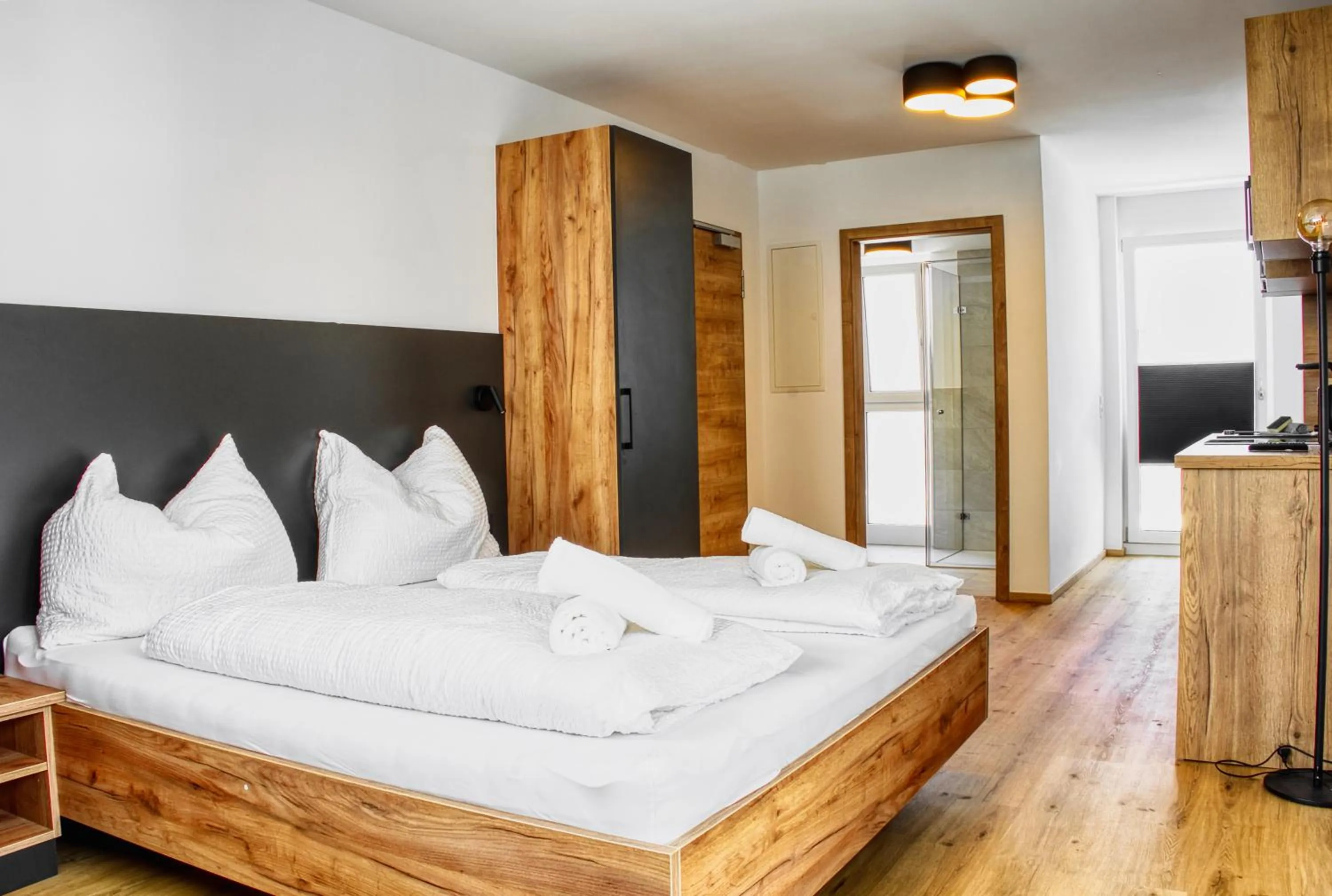 Bed in myQuartier City Chalets digital self check in