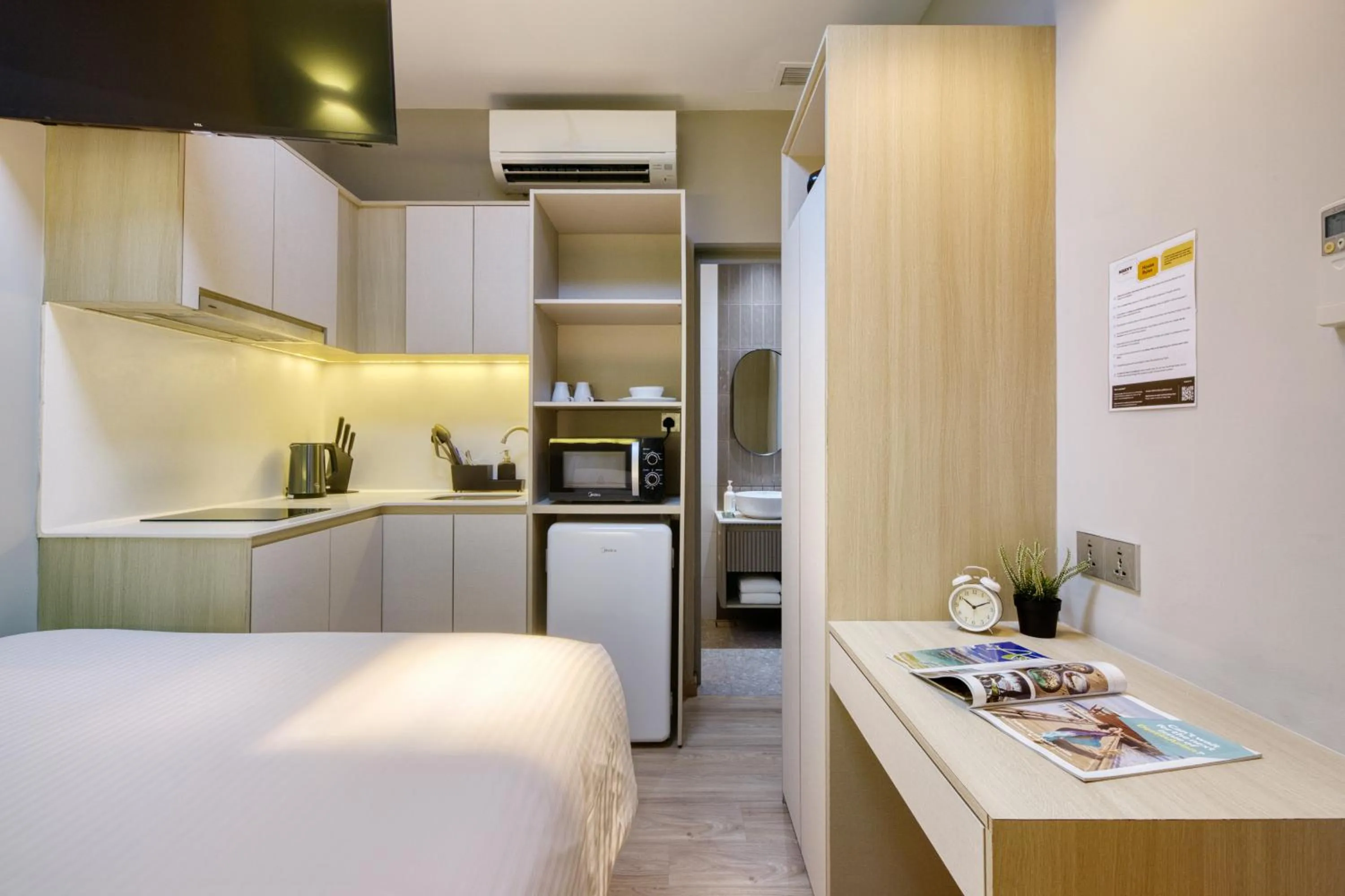 Photo of the whole room, Bed in Habyt Studios Kallang