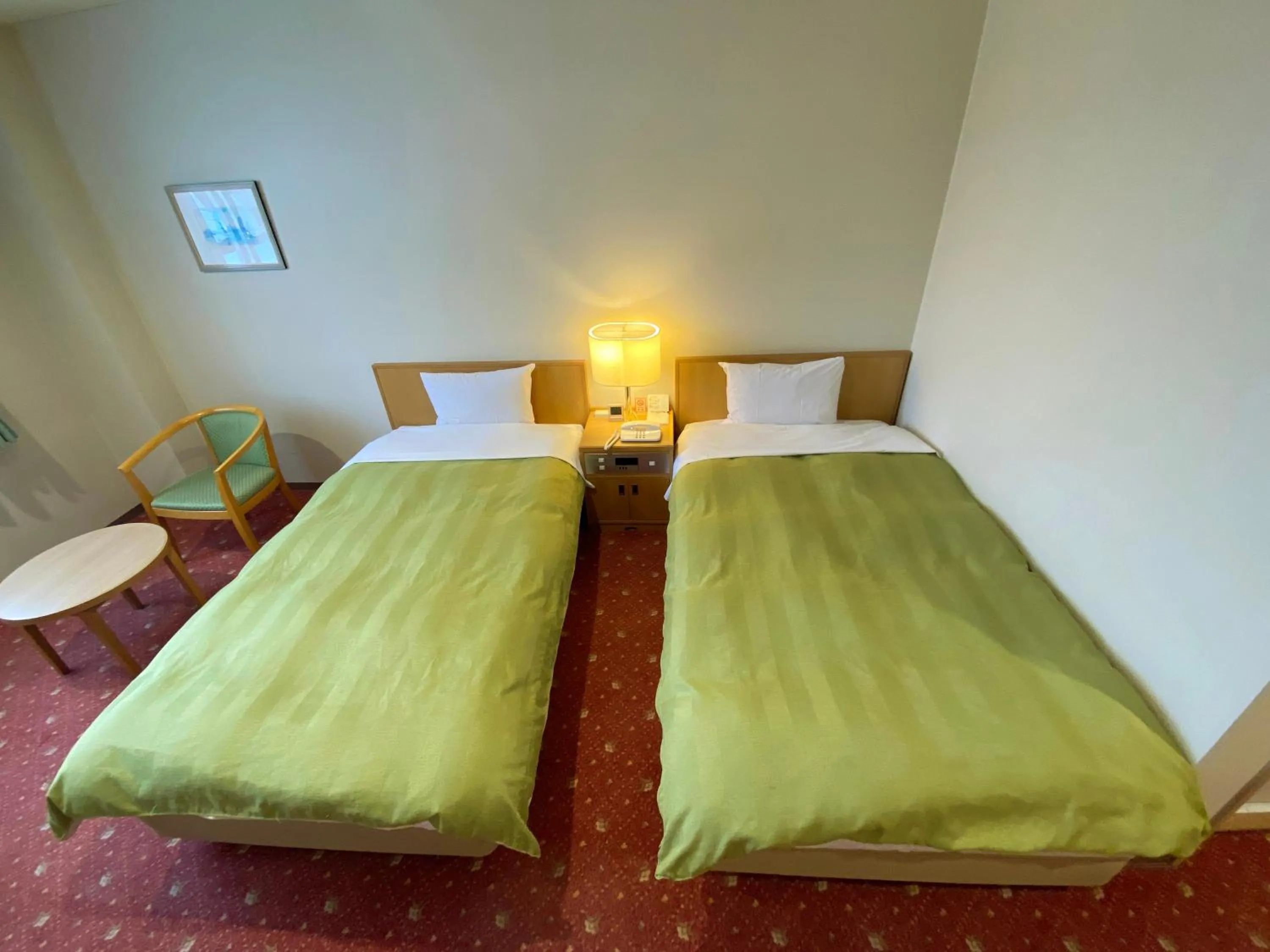 Bed in Hotel Lavenir