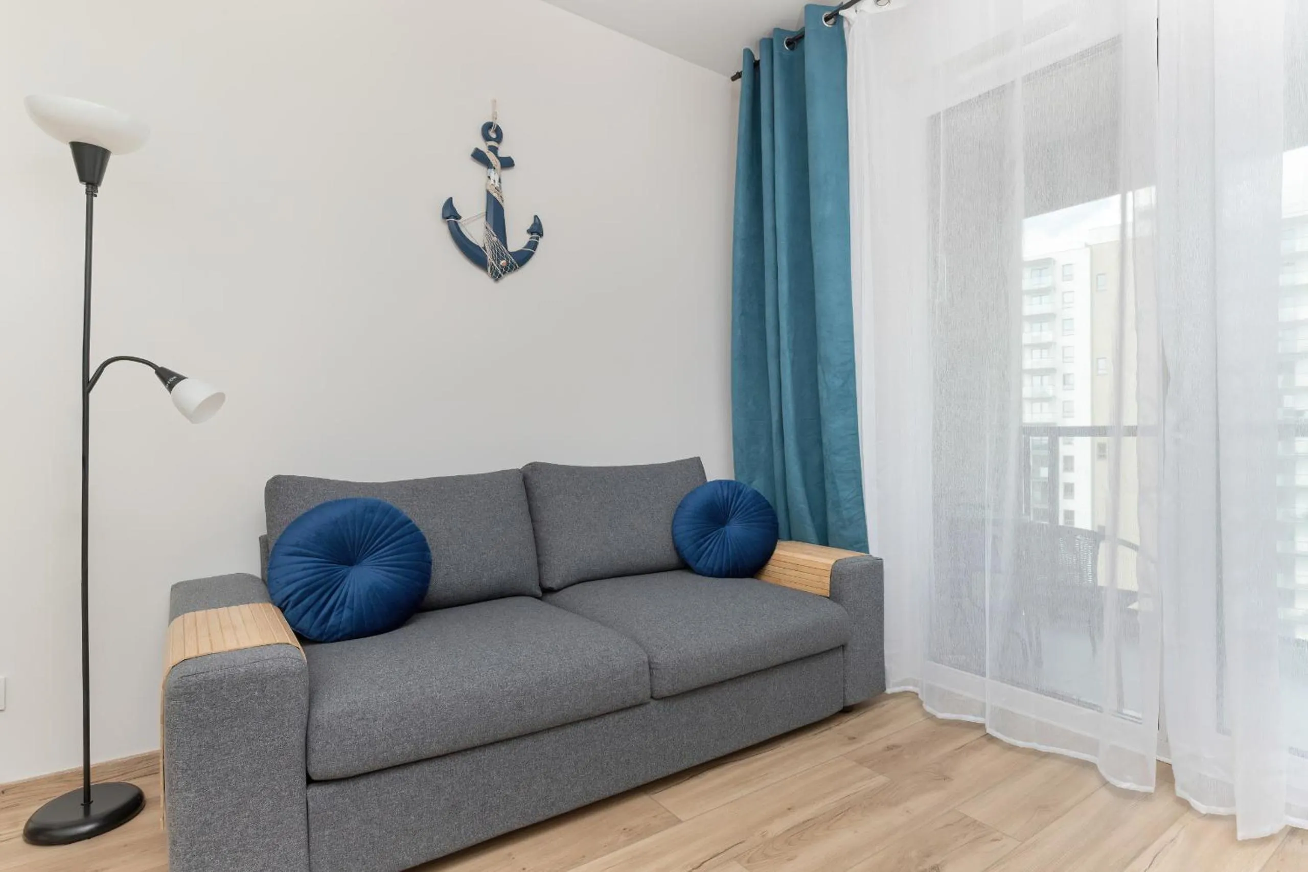 Communal lounge/ TV room in Nowoczesny Apartament z Parkingiem Nowa Letnica Gdańsk by Renters Prestige