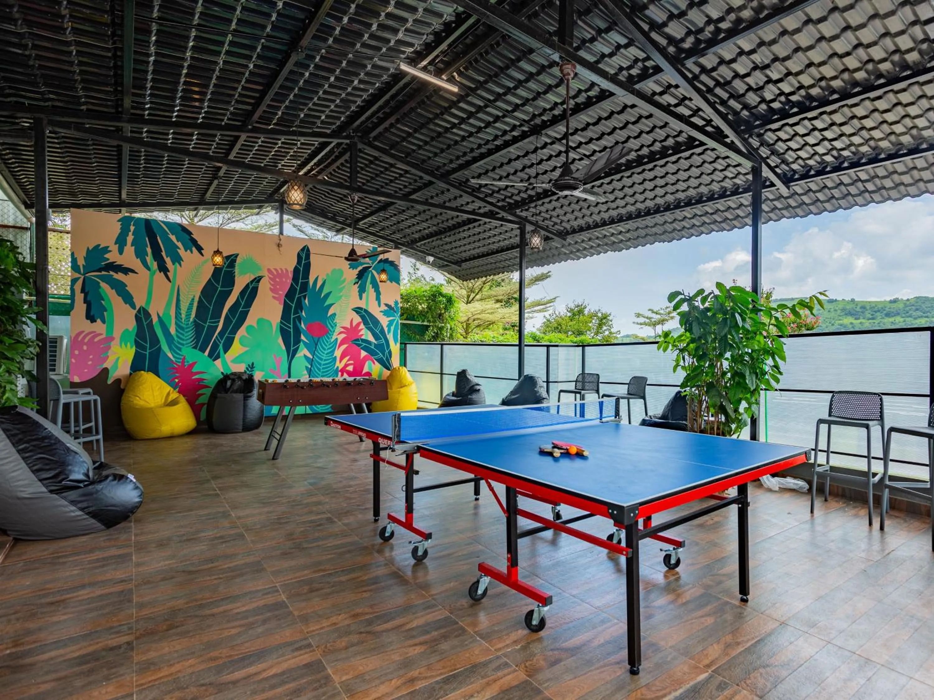 Communal lounge/ TV room in The Hosteller Panshet